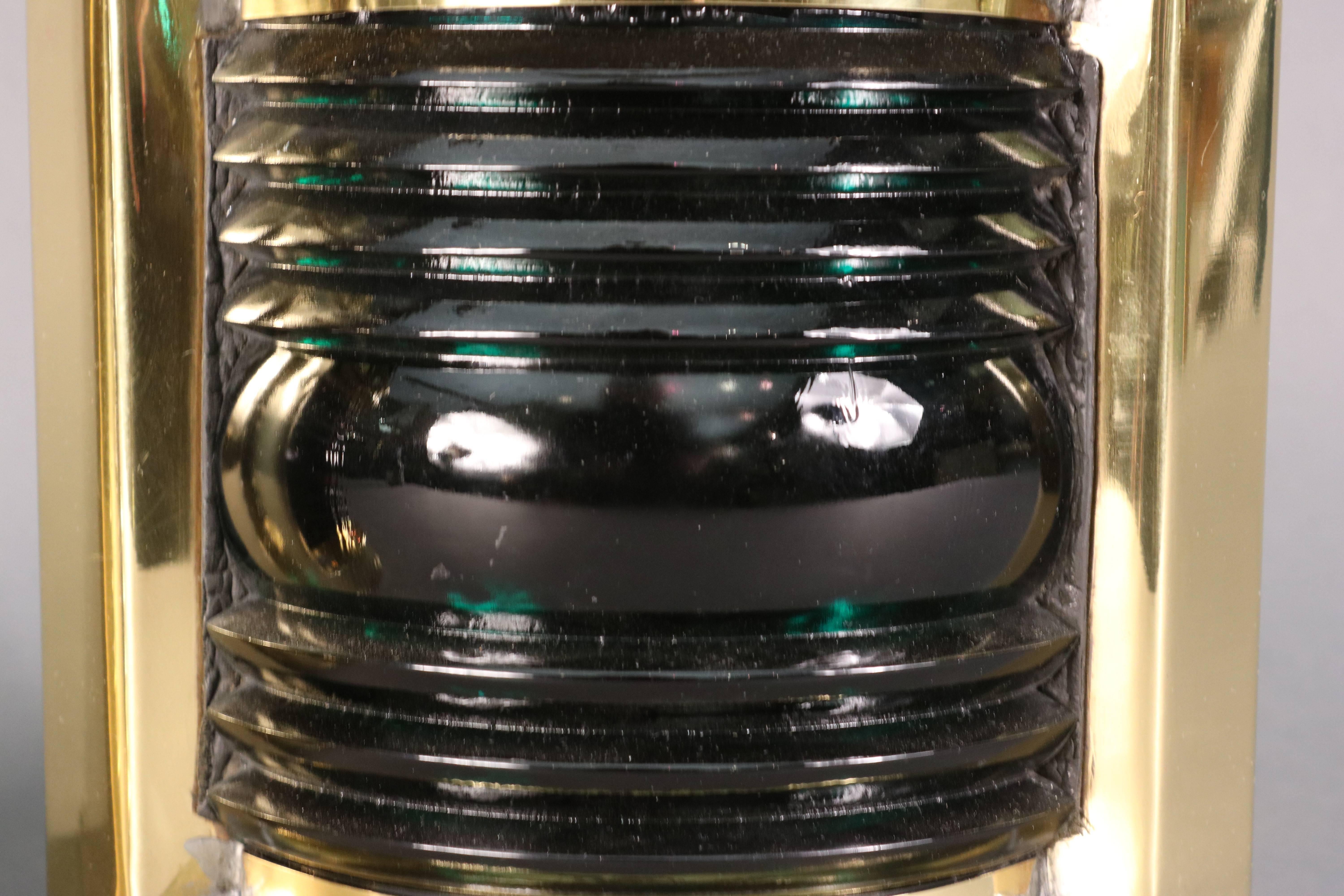 Brass pair of port and starboard lanterns by Wilcox Crittenden. Ruby red and green fresnel lenses with brass cases. Carry handle, corner back. 