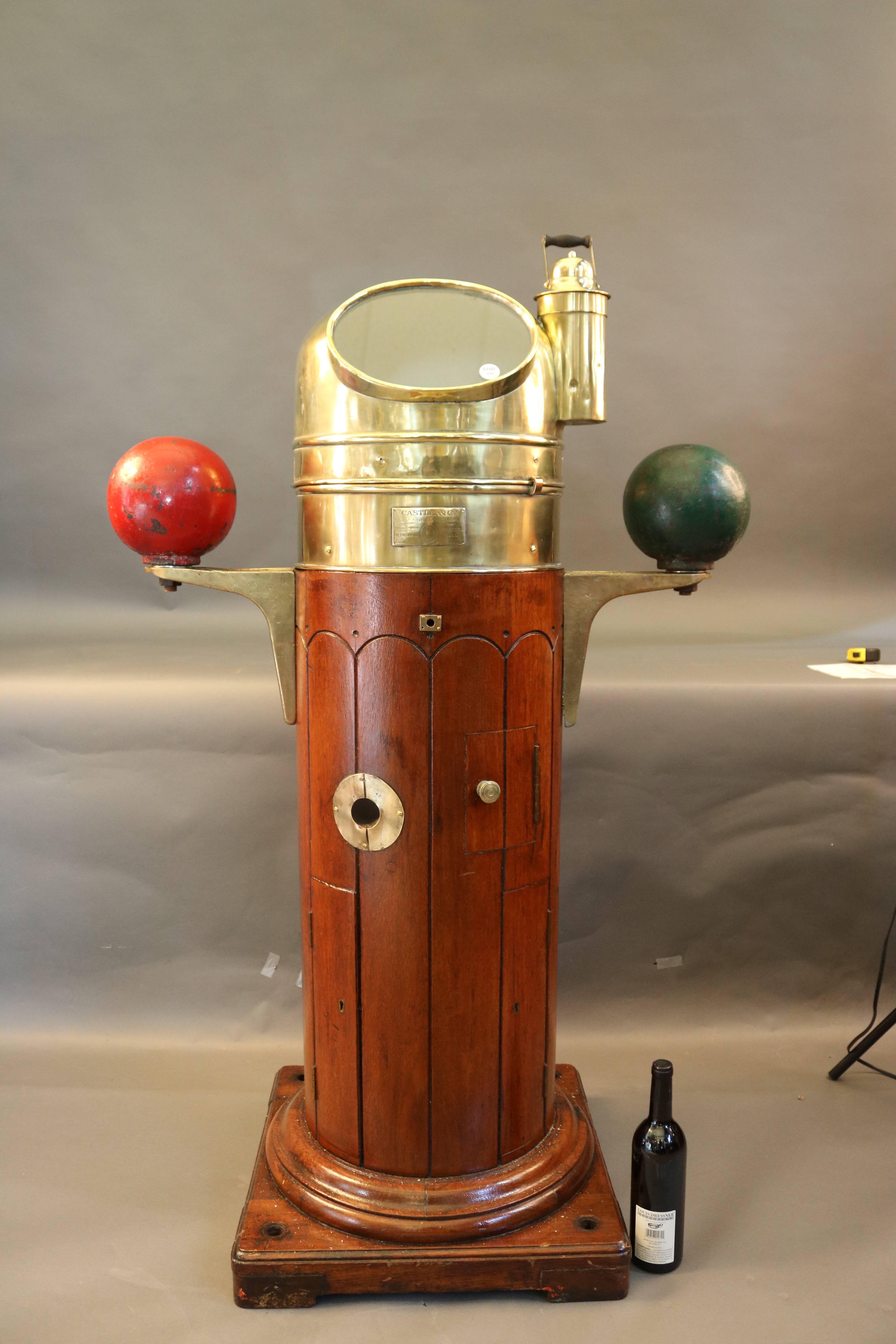 Binnacle by Castle and Co., compass of Hull England, with burner, compensating balls. Compass is a Mark I US Navy. Dimensions: 56" H x 33" W.