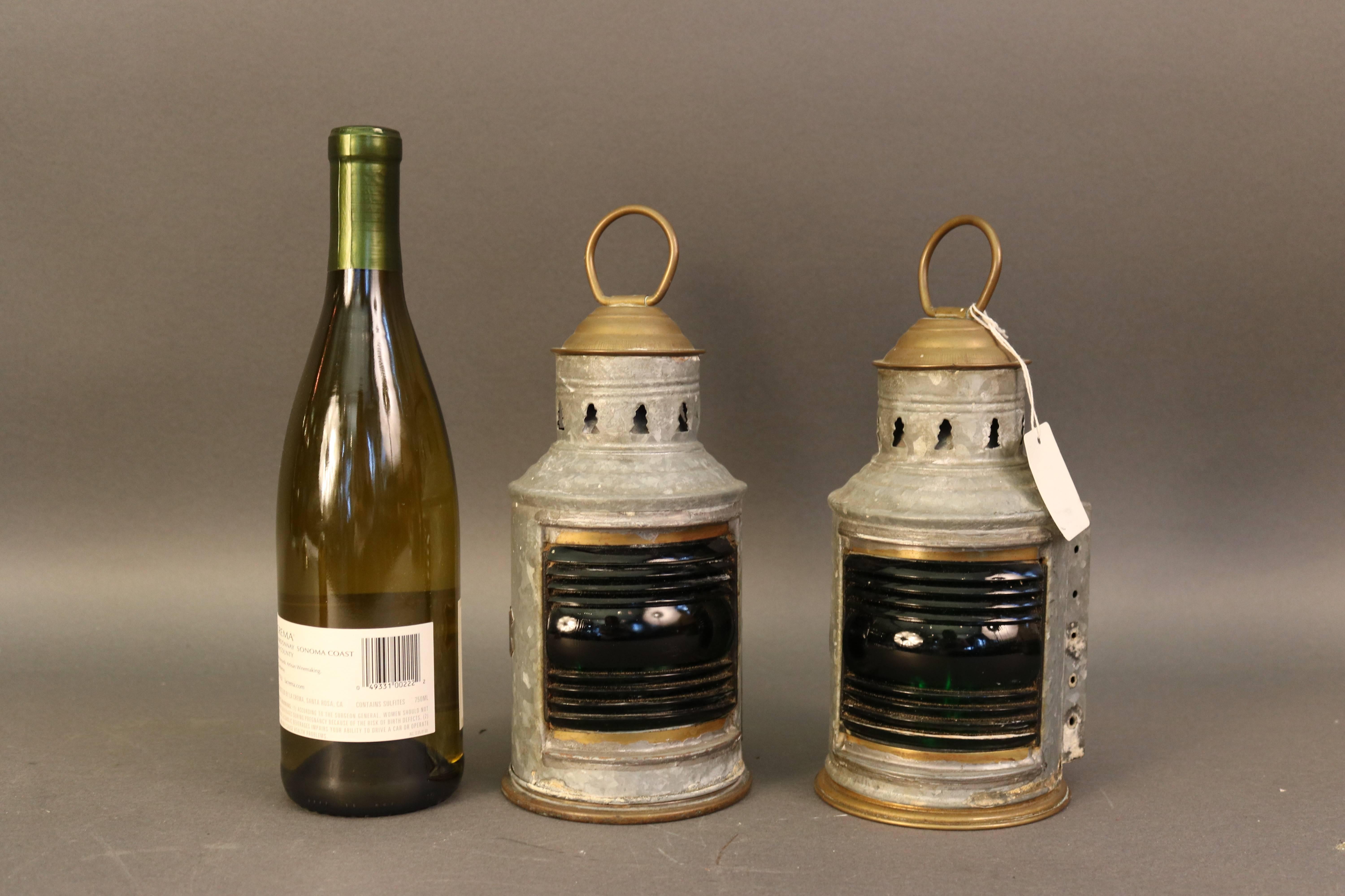 Pair of port and starboard lanterns of galvanized steel by Wilcox Crittendeon, Middletown, CT. Vented top, brass carry handle, rear mounting brackets. 360 degrees. Oil burners. Green and red Fresnel lenses. Overall dimensions: 9.5" H (with