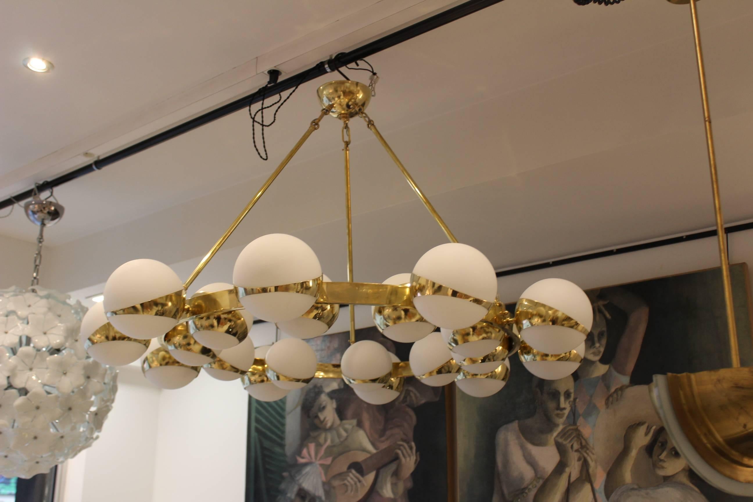 Italian twenty globes circle chandelier, brass and opaline glass, two rows of ten lights.