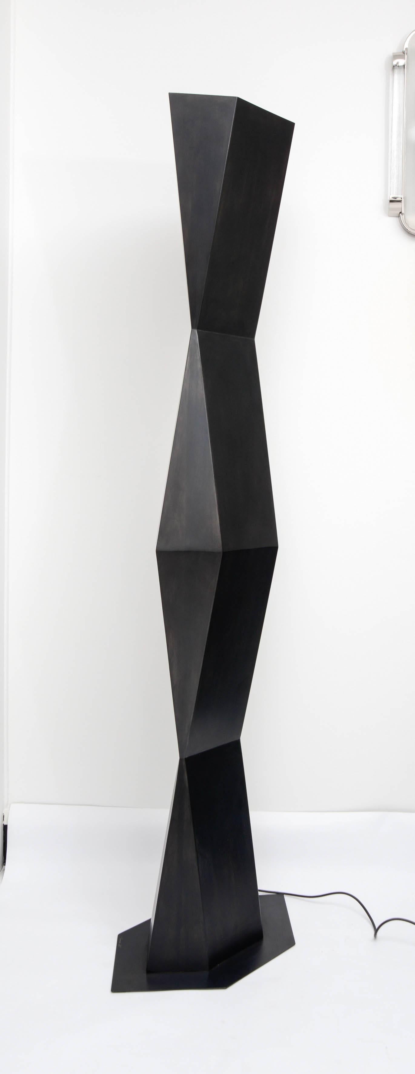 Floor lamp TOTEM by Stephane Ducatteau. Geometrical design, in oxidized steel and darkened patina. This line is an exclusive creation for Fortuna Modernism. Each piece is signed.
This one is a unique piece on this size.
   