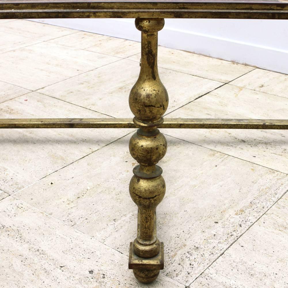 Octagonal low coffee table in wrought iron gilded. Top in clear glass.
In the taste of Gilbert Poillerat,
circa 1940.