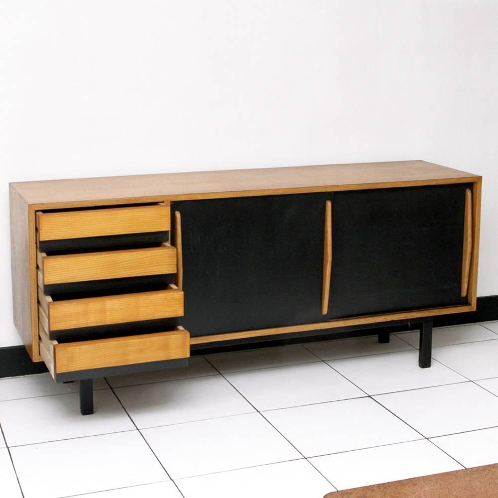 Charlotte Perriand Cansado sideboard in mahogany. 
Edited by Steph Simon, Paris, France.
From Cité Cansado, Mauritania, 1958
Four drawers and two black lacquered sliding doors.

