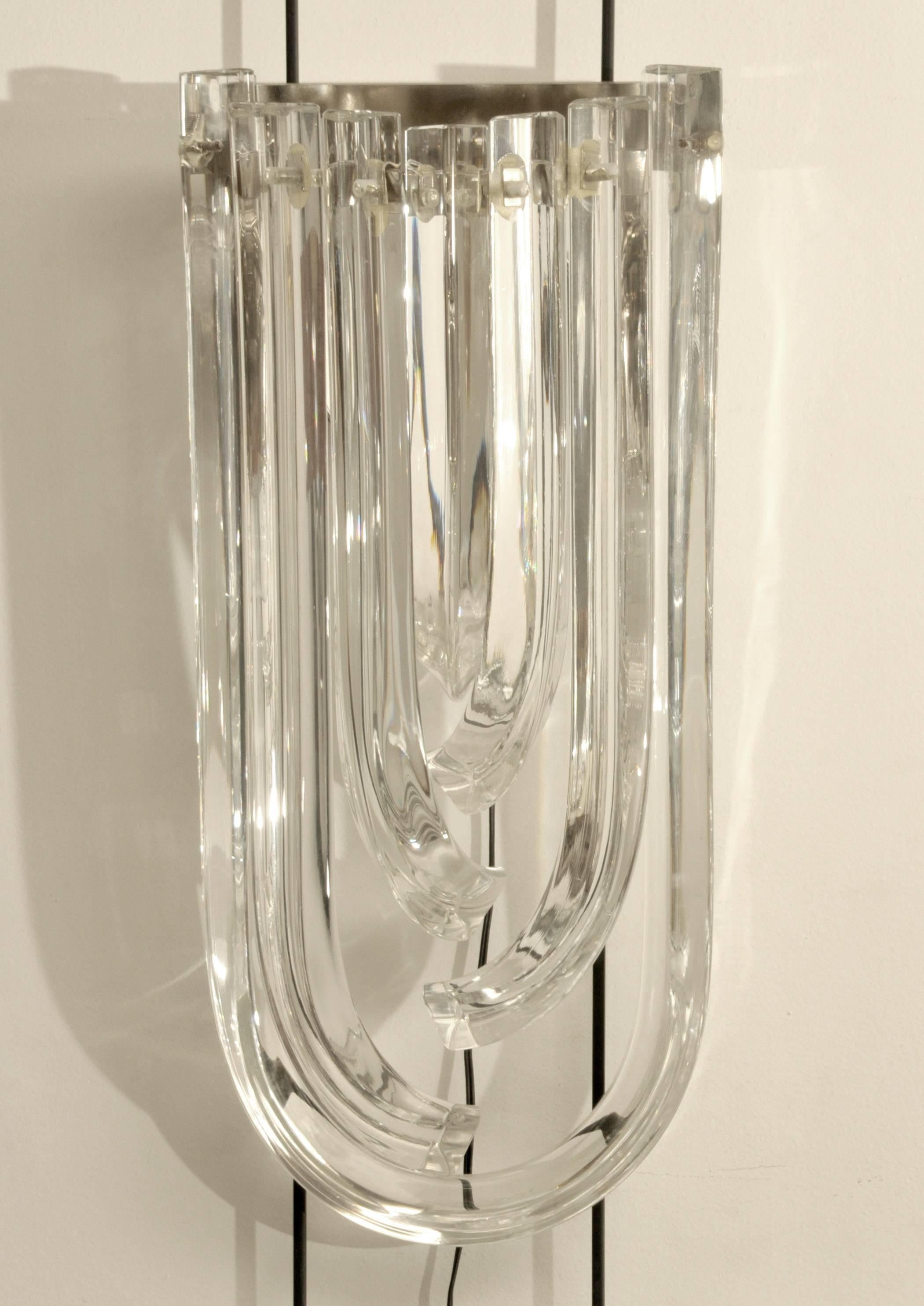Pair of Murano curved crystal sconces
Fixture in plated chrome.
Each sconce has one bulb.
Pair of sconces from a set of 8.