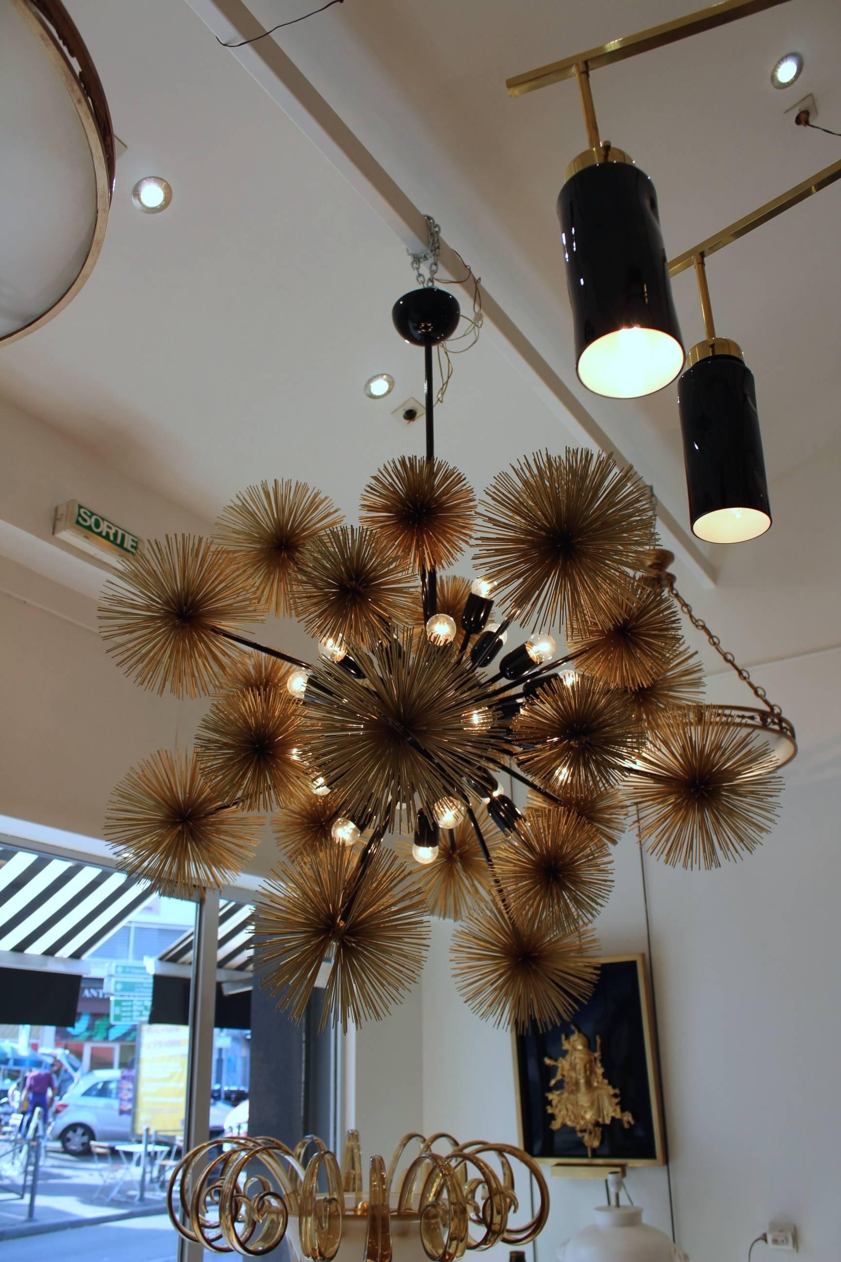 Beautiful and unusual sputnik chandelier, metal painted gold and black,
in excellent condition.