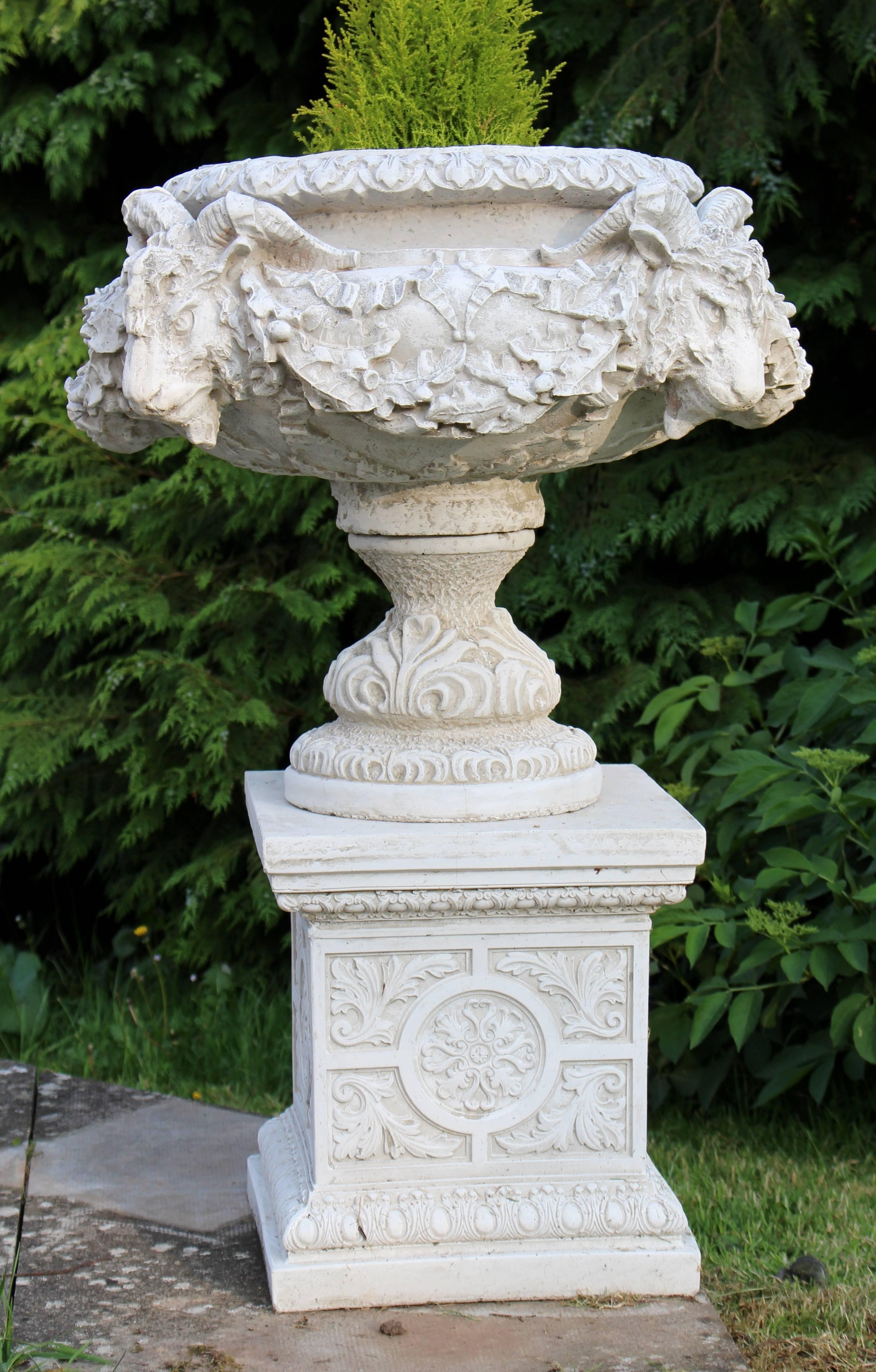 

Composition stone composite
finish antique white.
Measures: Width 67 cm / 26 1/2 in.
Height 98 cm / 38 1/2 in.

Very heavy pair of classical style garden urns.

Three sections: Top urn, socle base and pedestal base.

Classical mouldings