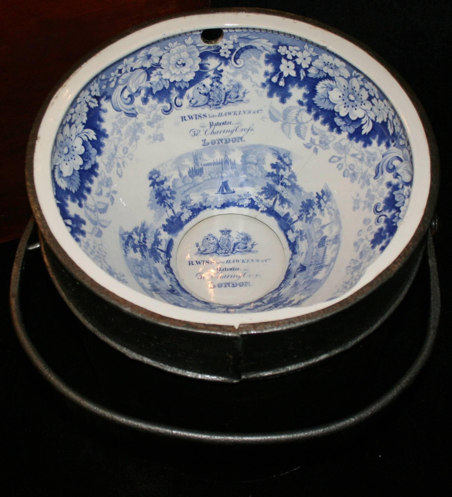 

Manufacturer R.Wiss late Hawkins & Co., London.
Porcelain blue and white.
Date 19th century.
Case pine.
Width 58.5 cm / 23 in.
Depth 48 cm / 19 in.
Height 44 cm / 17 1/4 in.
Condition Very good condition commensurate with age. One or two