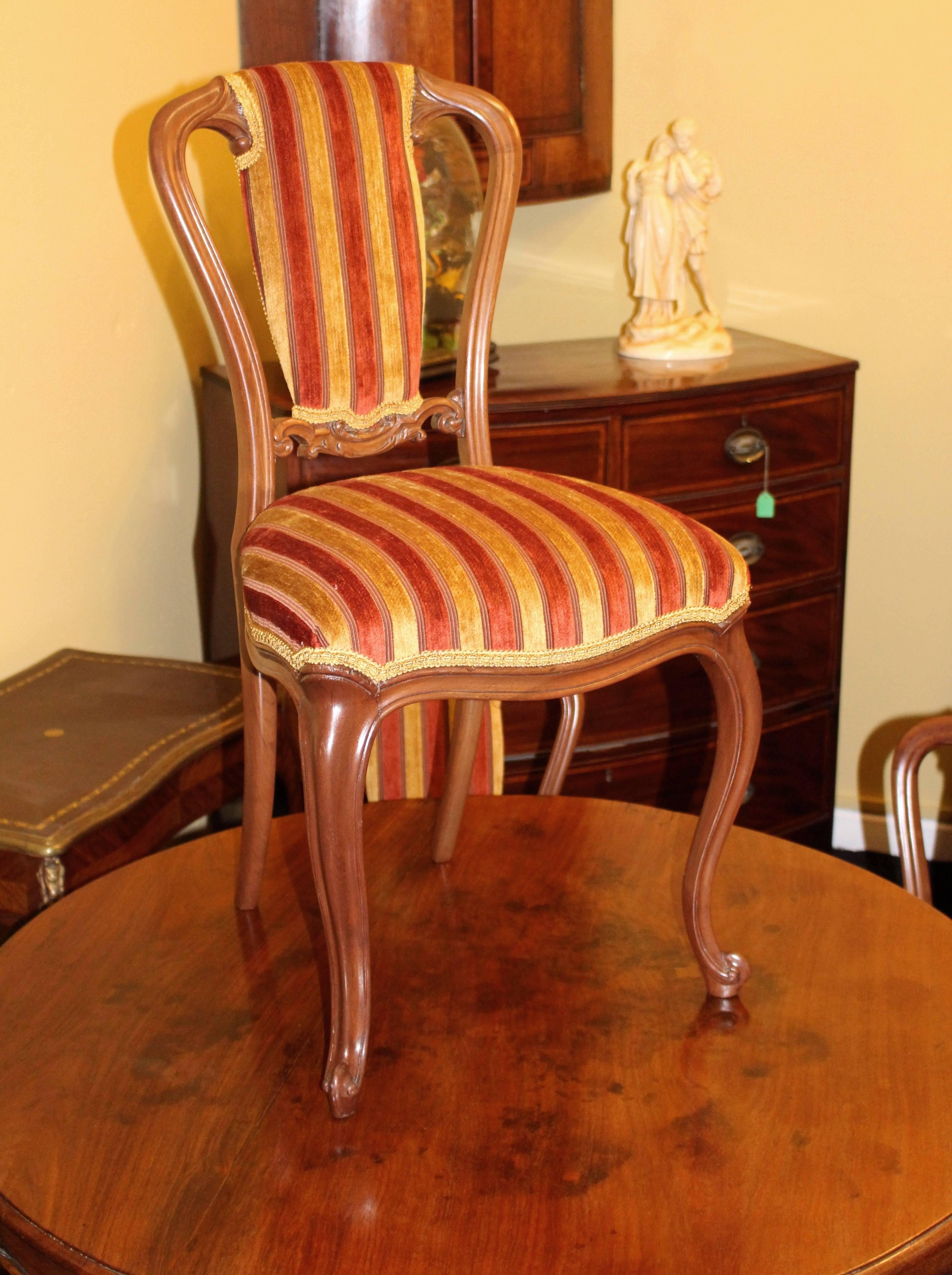 

Width 45 cm 17 3/4 in.
Depth 39 cm 15 1/4 in.
Height (to top rail) 85 cm 33 1/2 in.
Height (to seat) 47 cm 18 1/2 in.

Set of six.
Period Victorian.
Wood walnut.
Seats newly upholstered in a quality striped fabric fully up to British