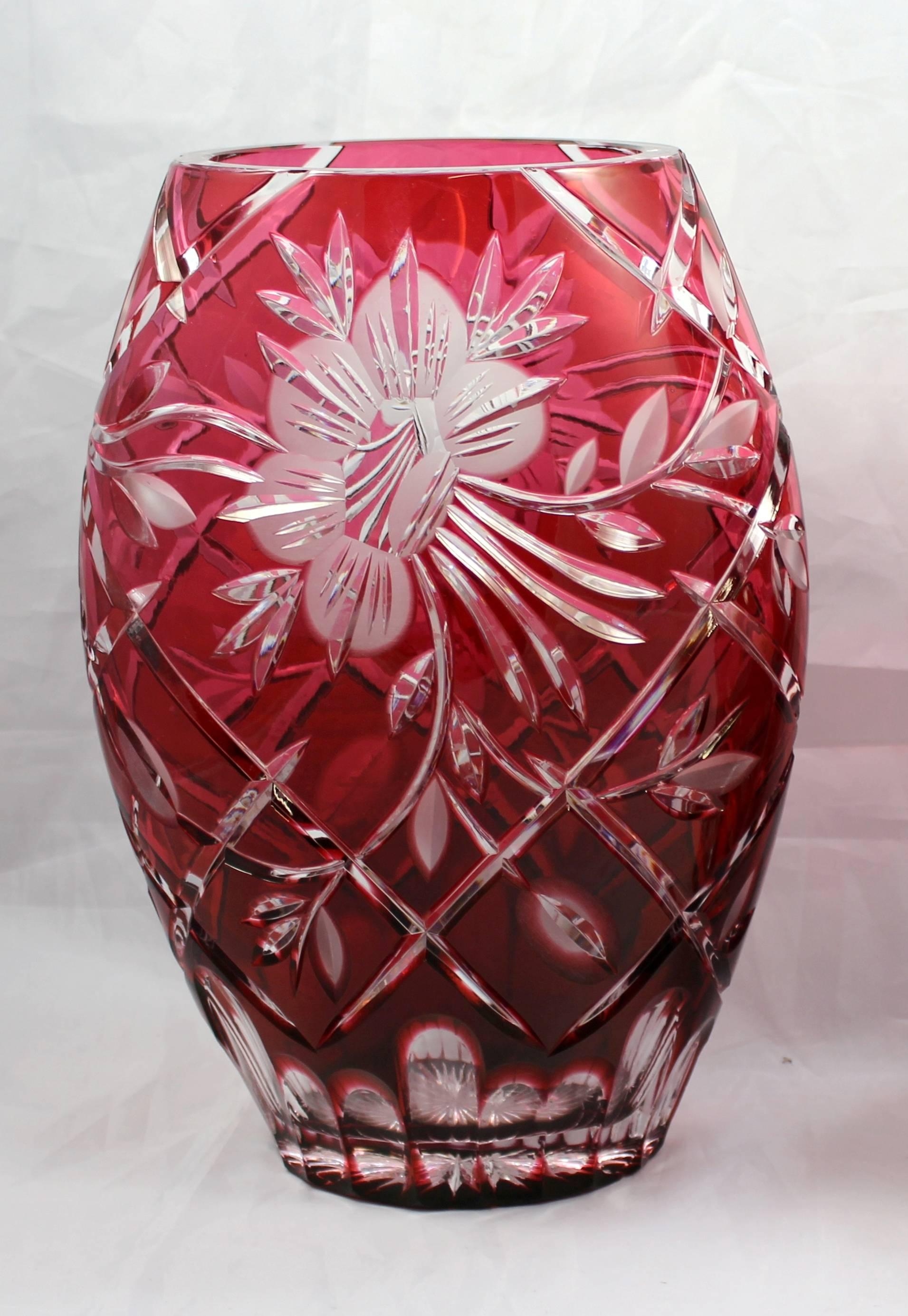 

Crystal	Ruby
Date	50's
Origin	Bohemian
Type	Vase
Width	18 cm / 7 in
Depth	12 cm / 4 3/4 in
Height	26 cm / 10 1/4 in
Glass	Cut glass, overlay crystal
Colour	Ruby overlay
Condition	Very good condition. No chips, cracks or repairs

FREE