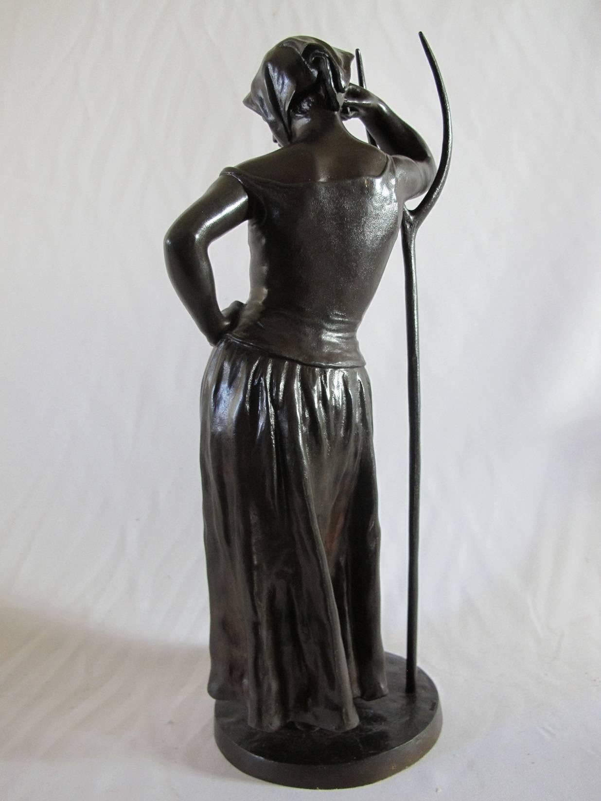 Bronze statue of a farm girl. Signed on the base; Alfred Boucher, (1850-1934).