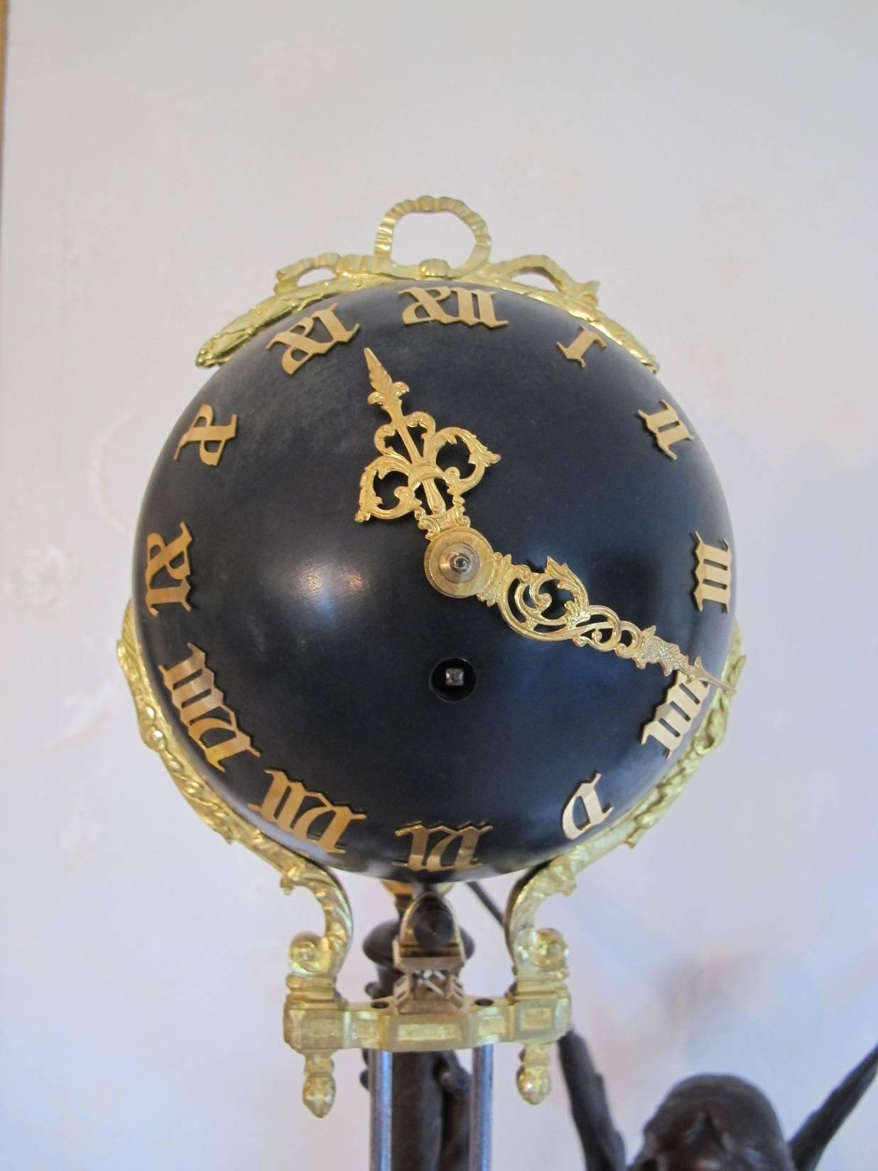 Large and impressive 19th century gilded and patinated mystery clock. The statue signed Henri Godet (1863-1937). On a marble base.
In excellent condition.

Measures: Height 121 cm.
 