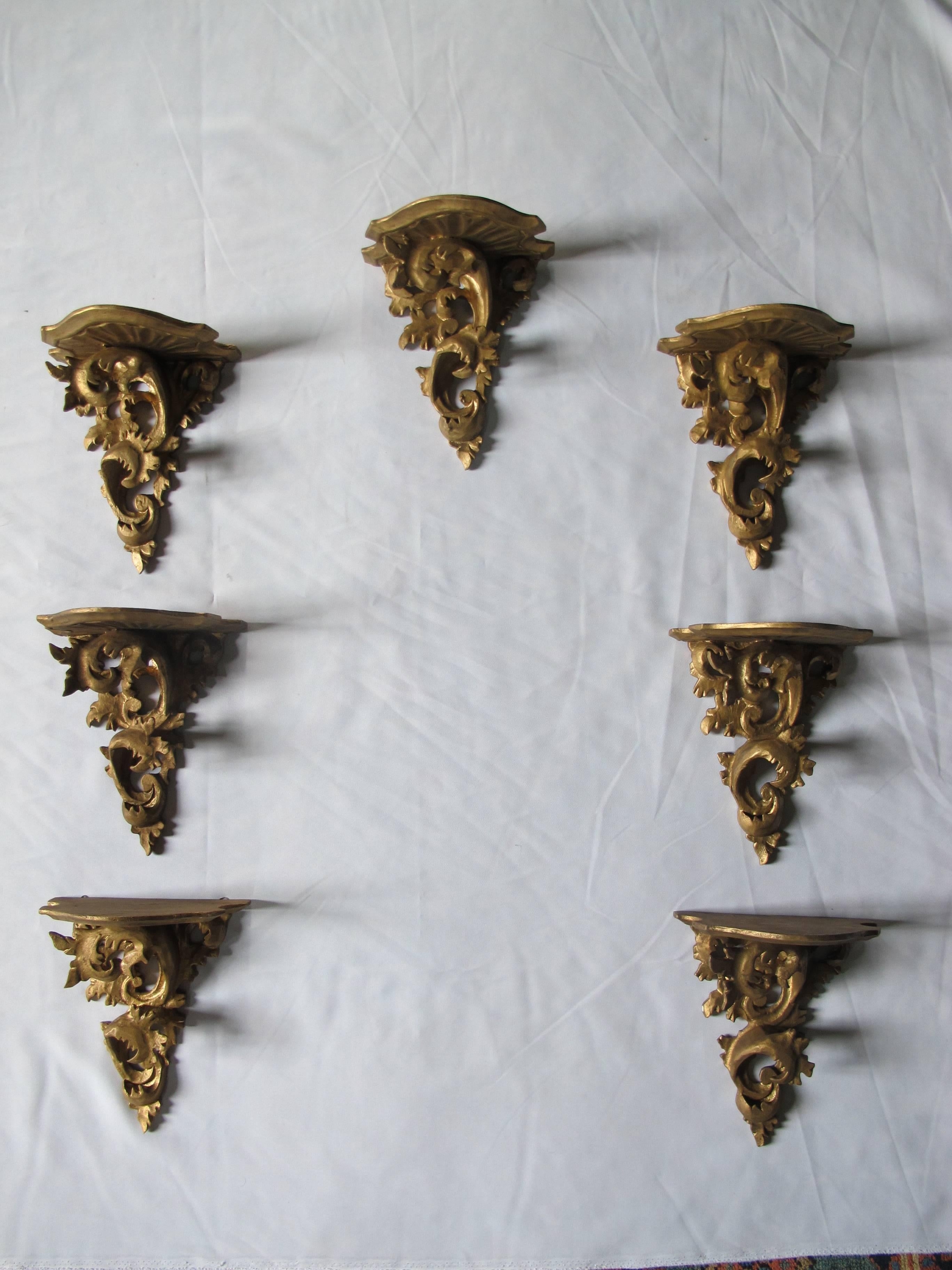 A set of seven wooden, finely carved, wall brackets.
