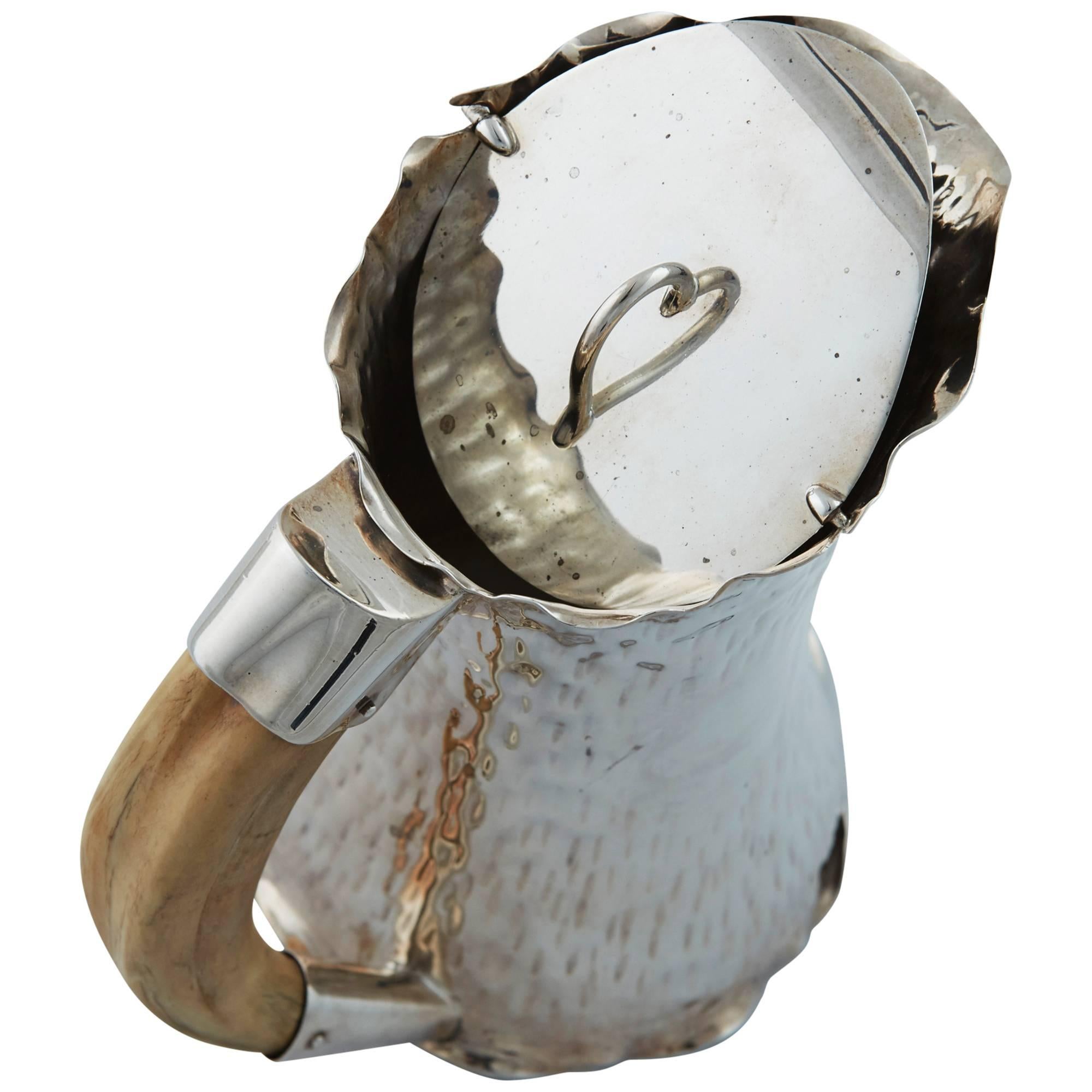 Large hammered silver plated pitcher with boars tooth handle, English, c1900. The handle is reinforced with silver on both top and bottom for extra stability.  