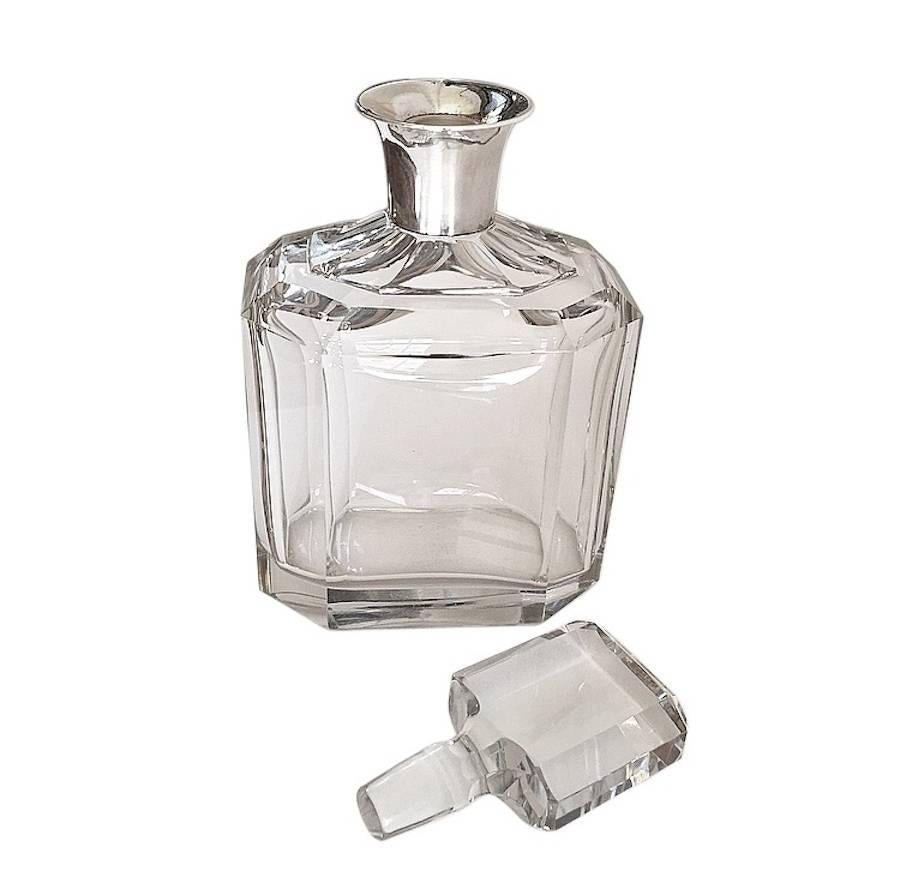 Large Asprey crystal decanter with silver collar.