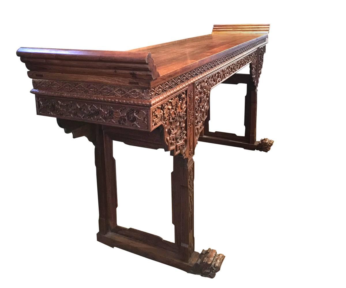 This magnificent and immense Chinese huanghuali wood altar table is one of the most dramatic we have ever seen. Please pay attention to the dimensions as this is not your typical altar table size. It would be perfect not only for an altar as
