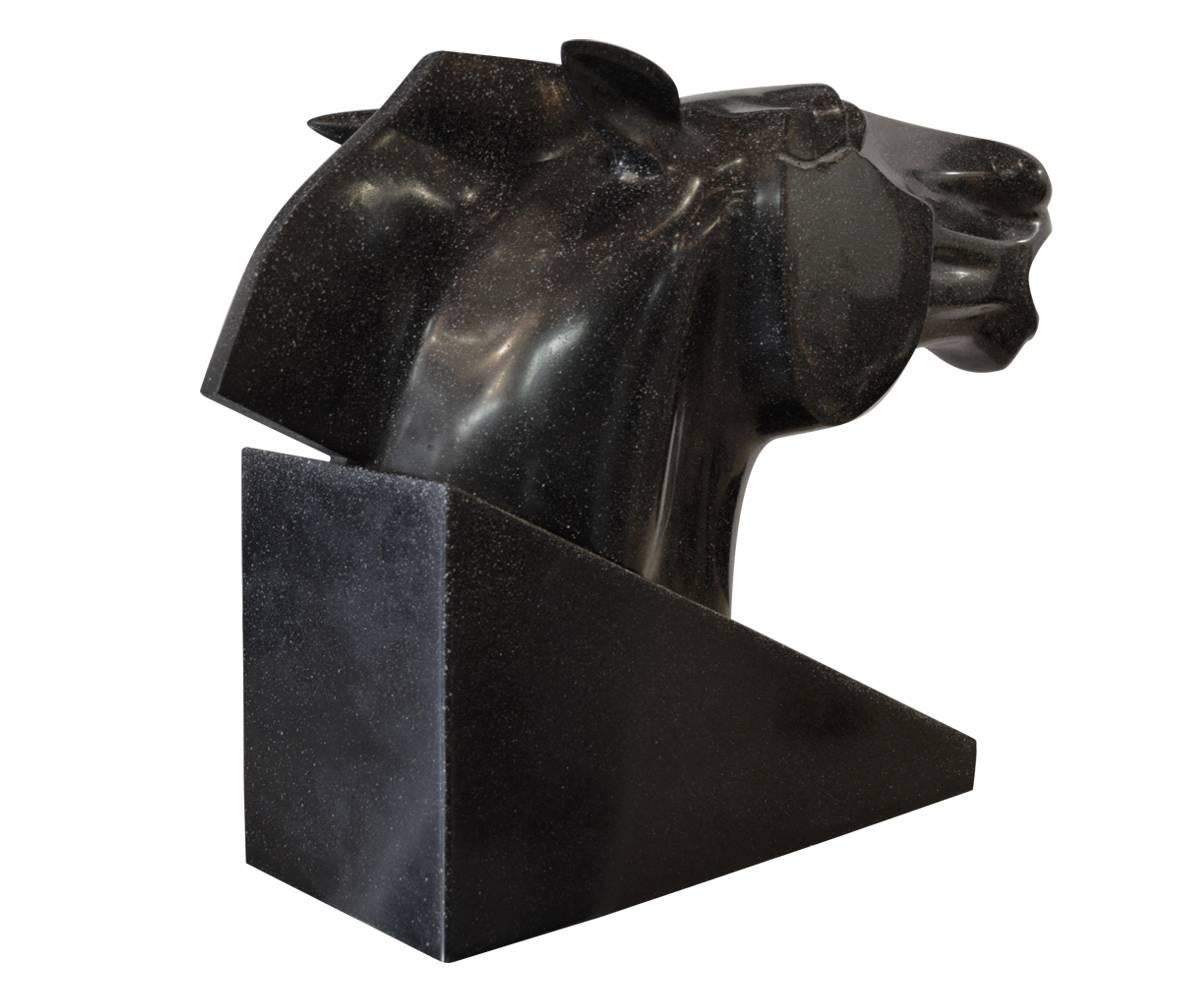 This is a marvelous vintage black stone sculpture by the Japanese artist Masatoyo Kishi (born 1924). The piece is a large bust of an animated horse made in cast stone. This piece is typical of the sculptor’s work in the 1960s.