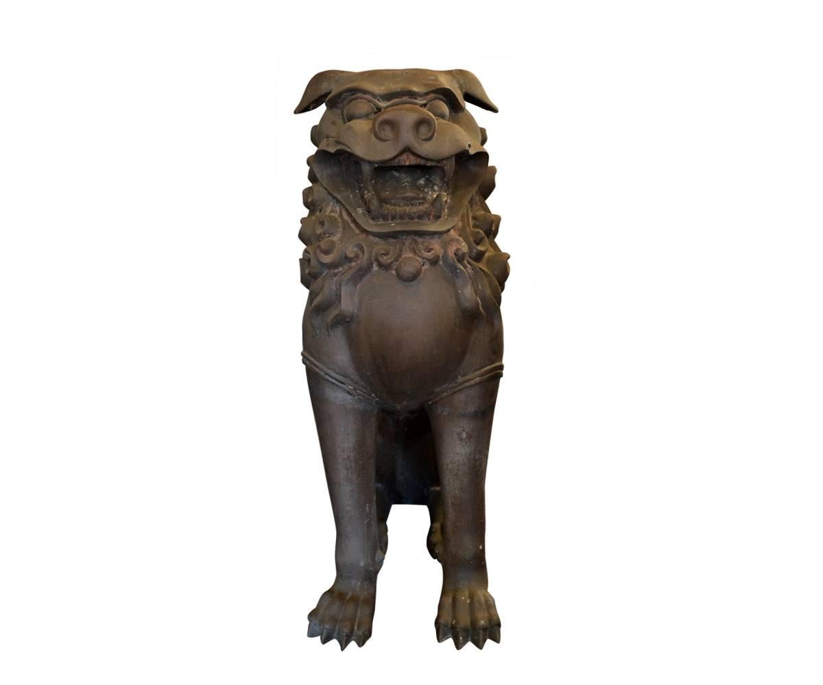 These two bronze Foo Dogs are a great size for displaying aside an entrance door or fireplace. The patina differs slightly between the two but they are truly meant to be displayed together as a pair. They have very good details and most importantly