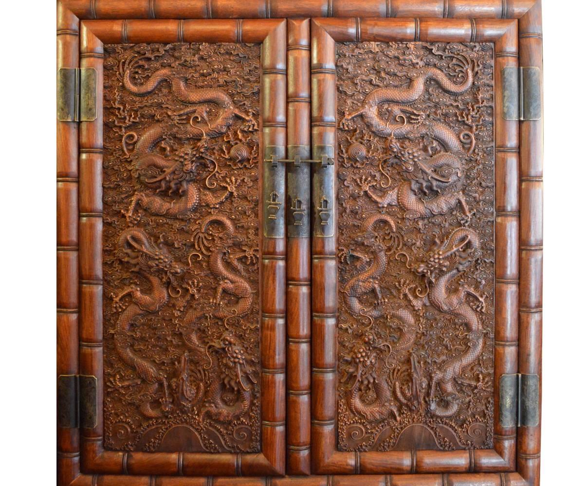 These cabinets truly comprise four pieces as each piece actually is a tall cabinet with a smaller cabinet on top. The deep carvings are quite unusually as they include the five fingered Imperial dragons which were prohibited from being displayed,