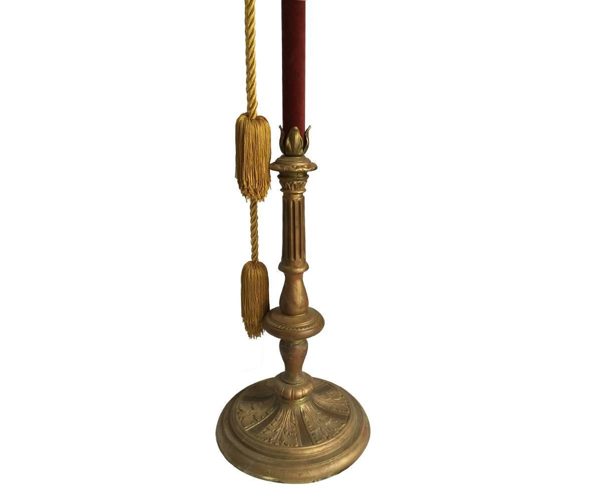 A pair of bronze and iron torchiere floor lamps in the manner of Oscar Bach, circa 1920. Having glass cylinder shades with swan and foliate decoration supported on posts with faceted crystal drops and ornate base.