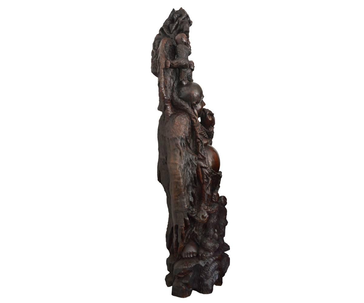 This item is carved from one piece of rose wood and features a happy Buddha accompanied by children and flowers. It is just a delightful addition to any space and brings you happiness, wealth and health!