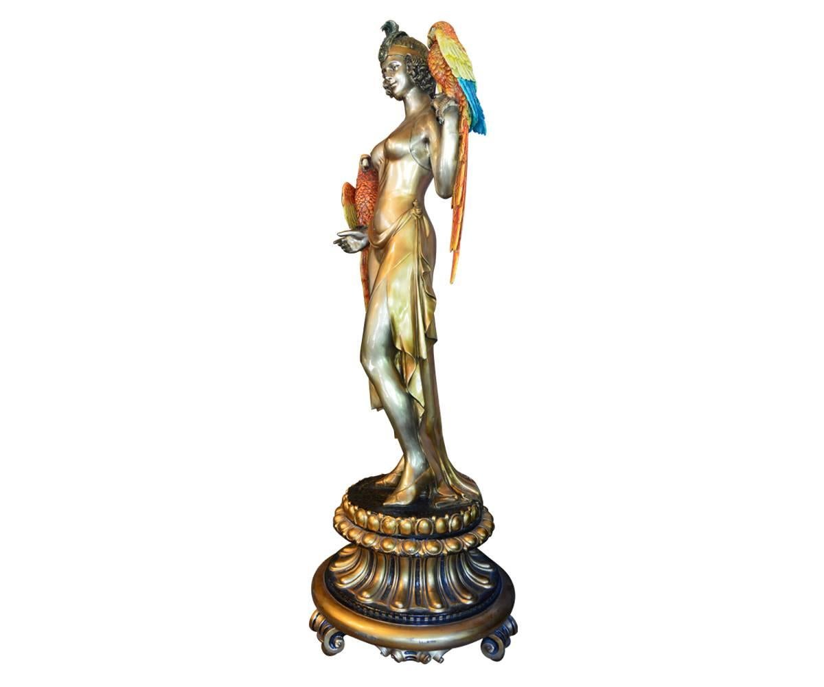The beautiful maiden in this statue is accompanied by two colorful parrots and is a wonderful piece for either indoor or out. We would love to see her in a garden with colorful flowers although she would be the centerpiece of any room also.