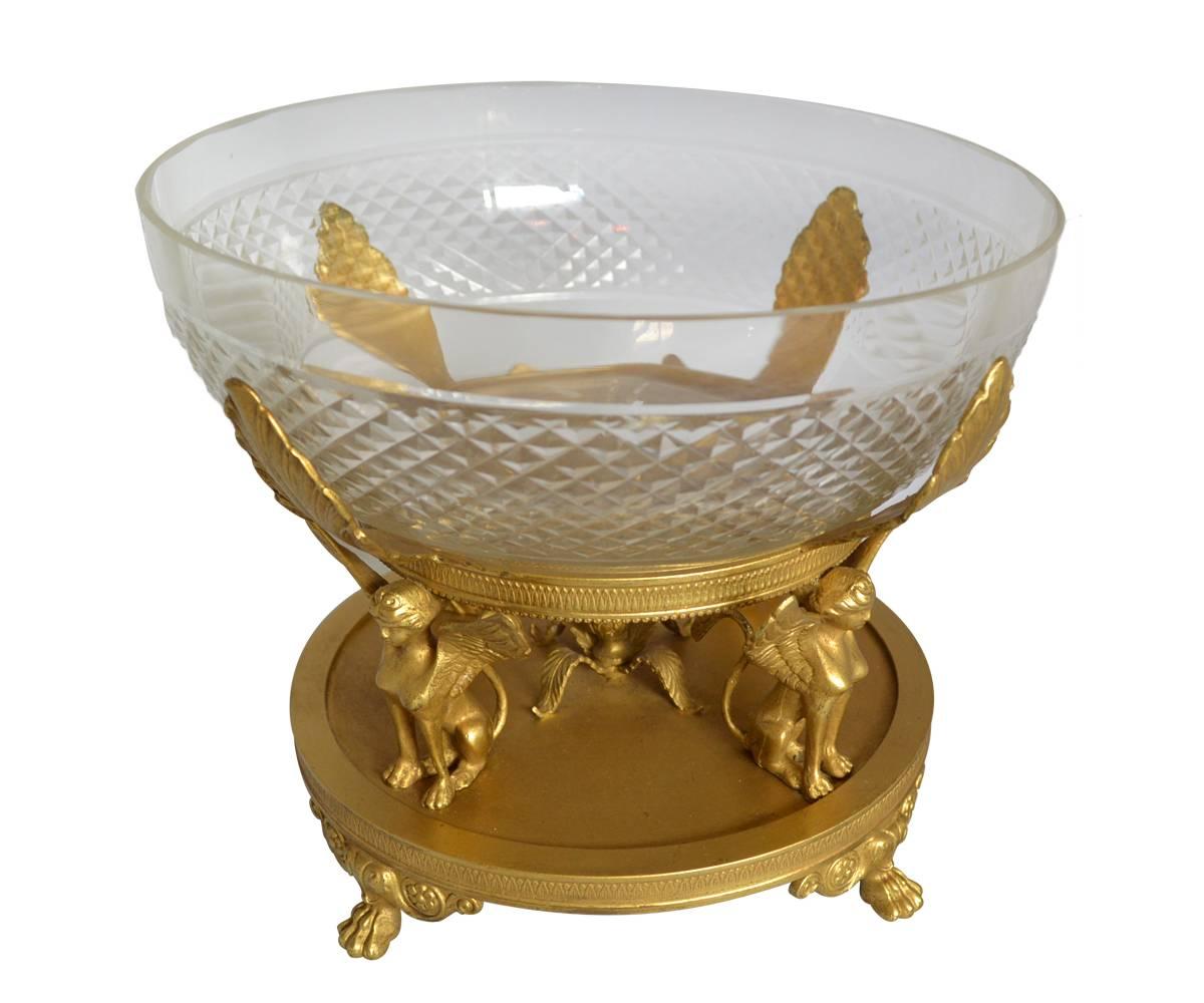 This impressive bronze centerpiece has its original cut crystal bowl attributed to Baccarat. The bowl sits on four bronze leaves all of which are supported by four wonderful Sphinx.
