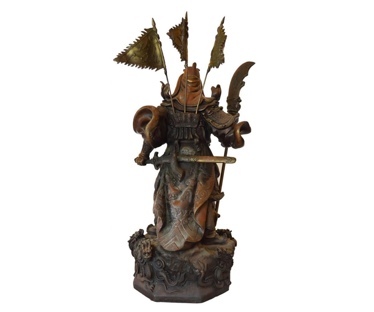This is great piece with excellent cast details. The warrior general is holding a sword and has three flags on his back.
