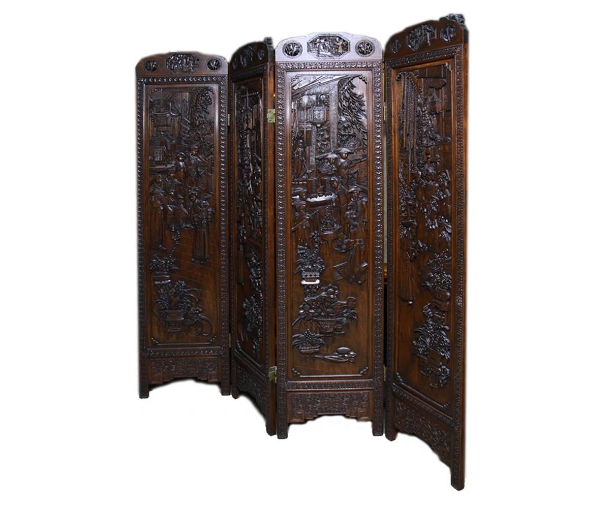 This screen is highly and expertly carved and features traditional Chinese scenes including monks and Quan Yins.