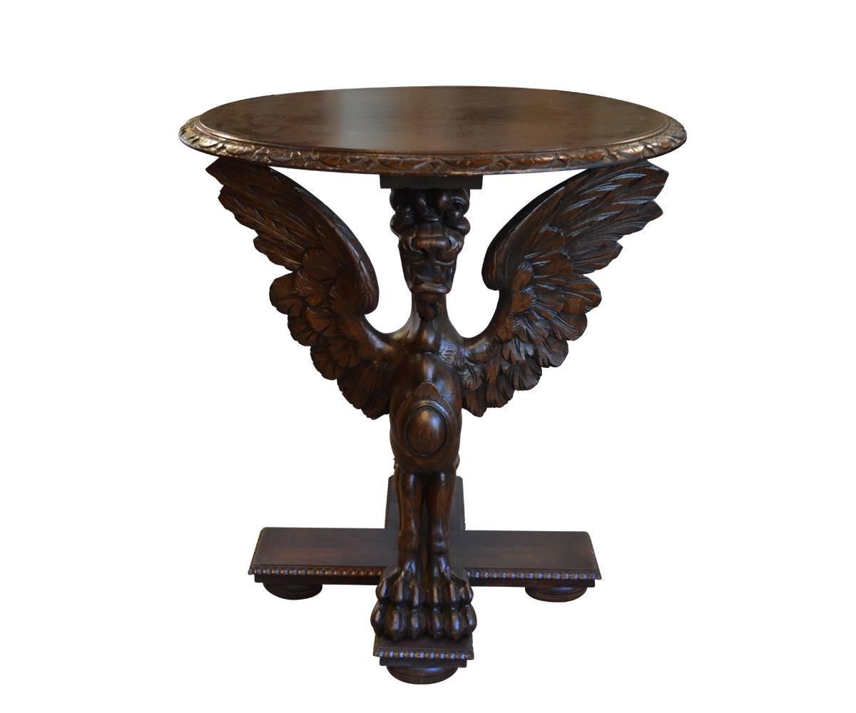 Stunning pair of hand-carved round side tables. These two griffin tables have been fully refurbished to original shape and stained with new top and base however the griffins are original French hand-carved antique walnut.