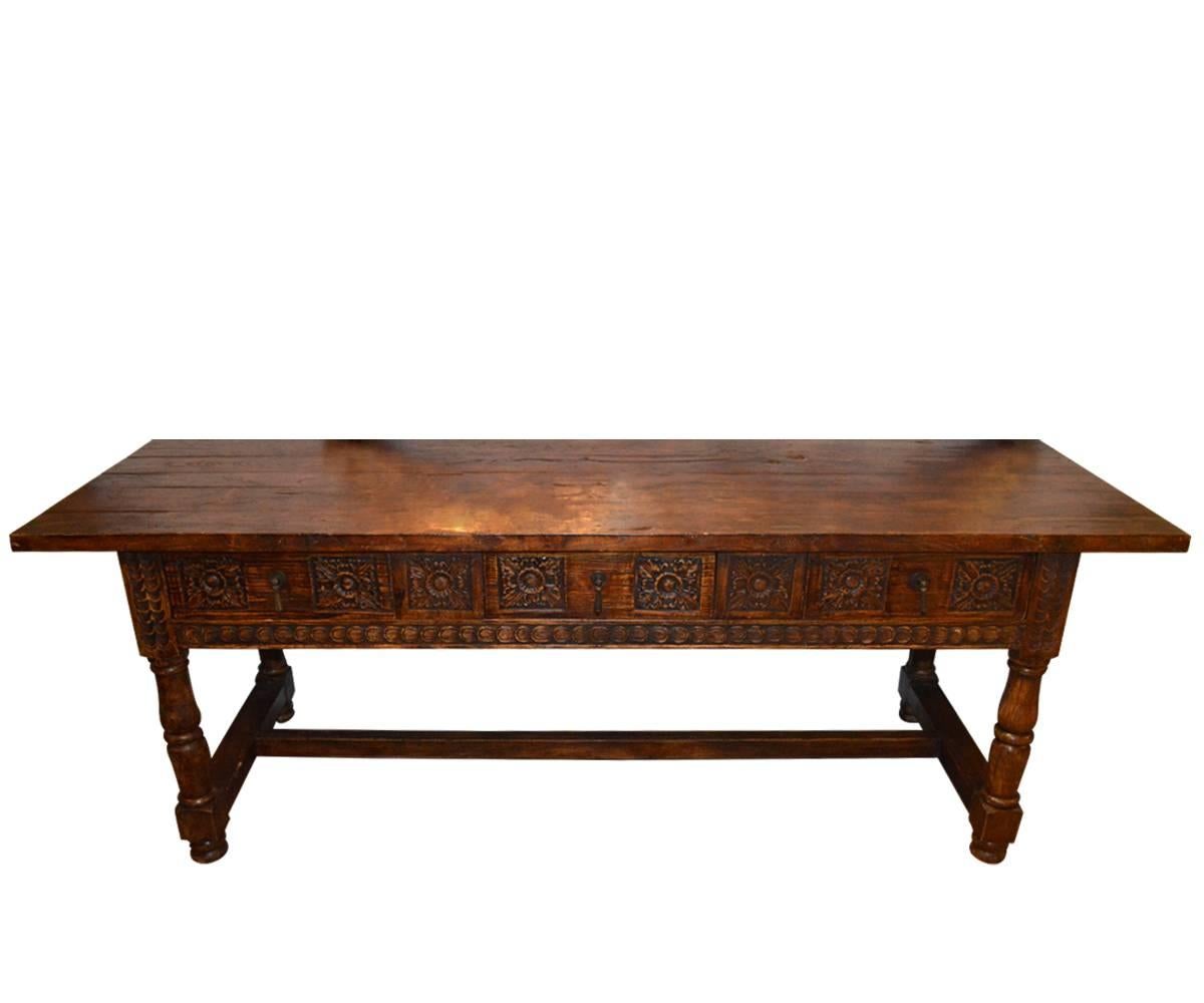 We proudly offer this magnificent antique Jacobean hand-carved oak refectory table with two drawers. It is from 18th century, England . It stand on four carved legs with a stretcher in middle. As it has two drawers it could be used as a desk. The