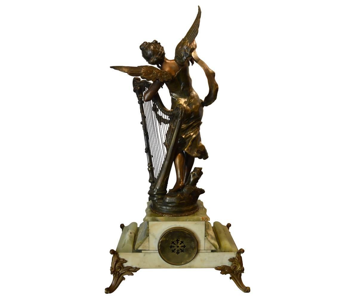 Massive French garniture clock set with signed Francois Moreau, circa 1880.The sculpture depicts a beautiful woman in the Art Noueau style with harp. The base is made of finely cut onyx with name plate is titled 
