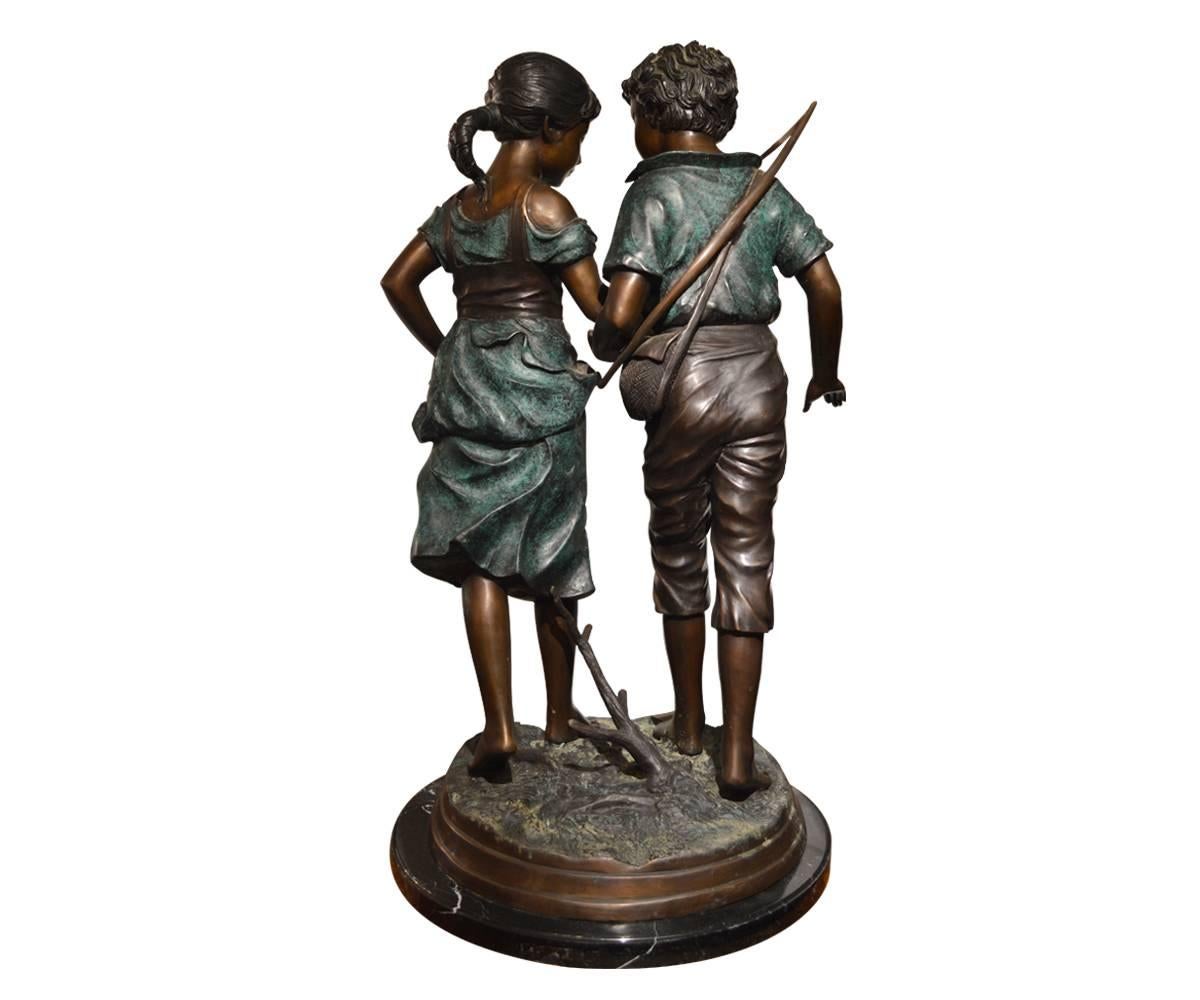 Offered is this wonderfully captivating bronze featuring two young children collecting berries. The character of the subjects truly make this unique artwork a delightful addition to any space. The bronzes are accented with hand painting and stand