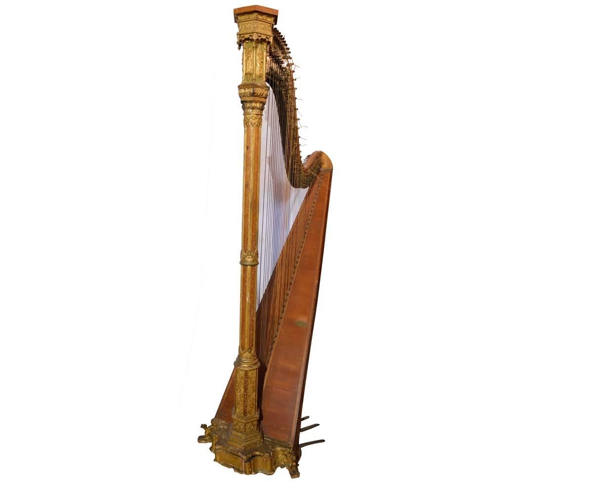 This magnificent Erard eight pedal harp is by the renowned Paris France manufacturer and is absolutely gorgeous. It has Gothic features with fantastic gold gilt remaining. bird's-eye maple further adds to the elegance of the piece. This harp is