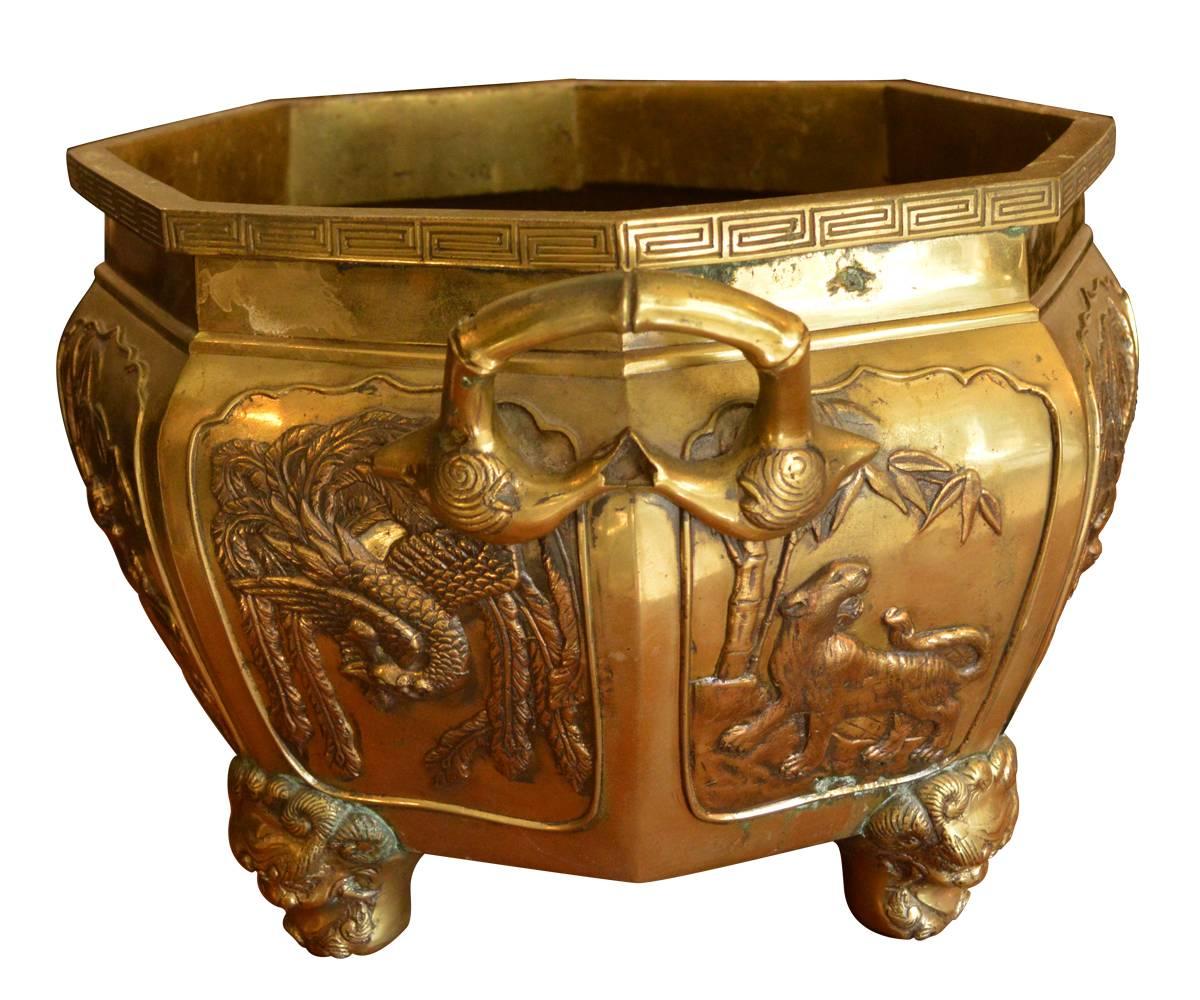 This attractive antique bronze planter has many of the interesting characters depicted on Japanese items such as this. They include lions, dragons and birds on the handles.