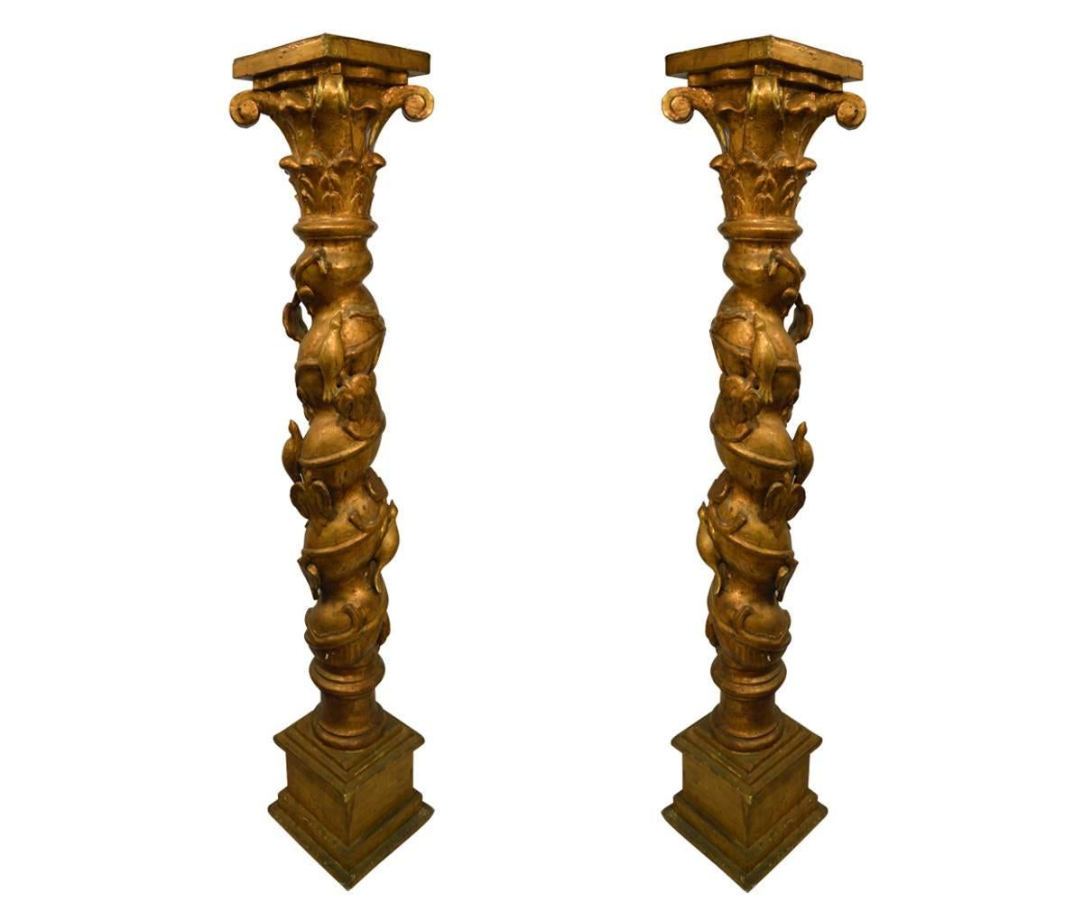 These pedestals are unique in the amount of carving and feature birds and foliage. These are hand-carved wood with gesso and gold gilt.