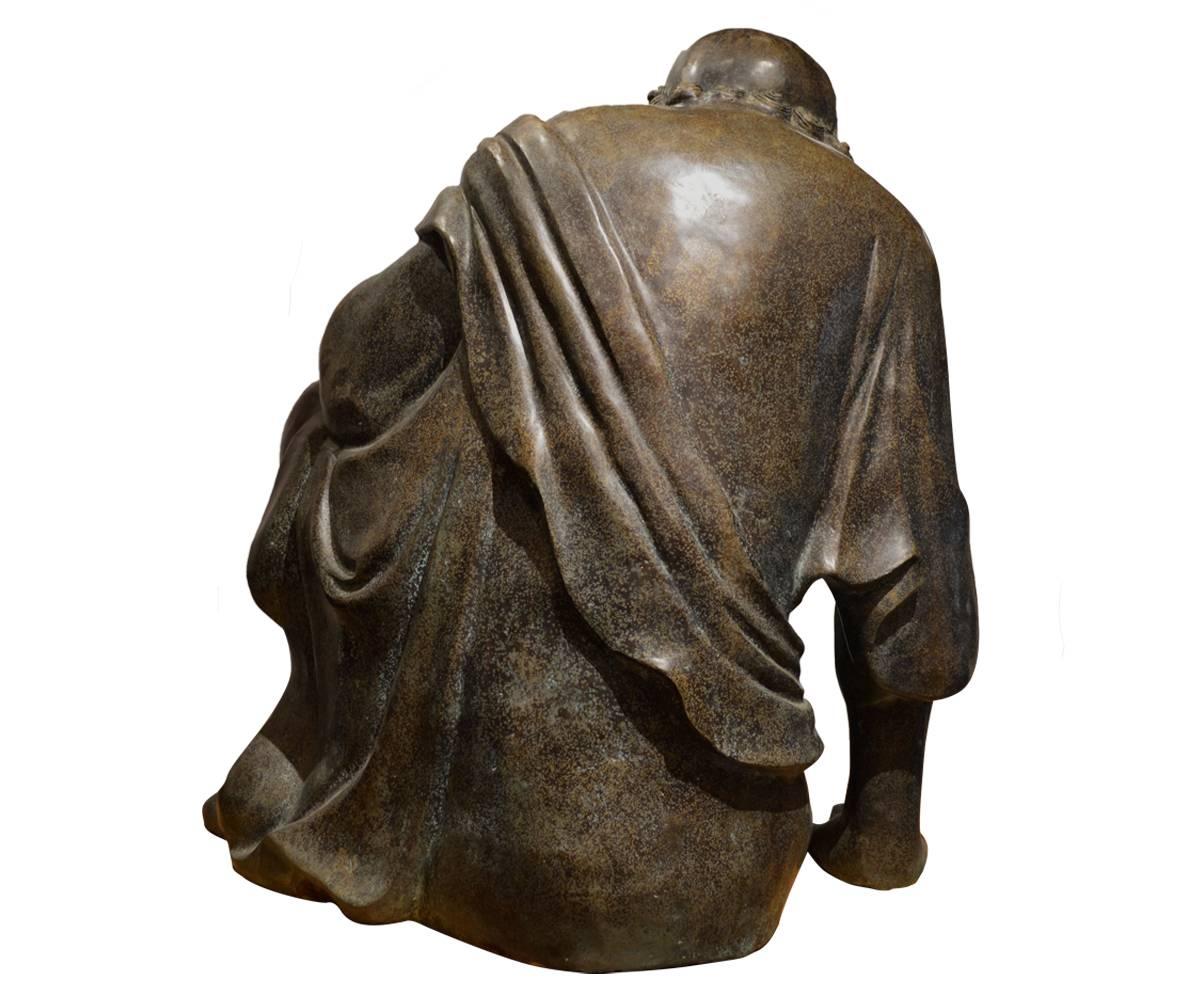 This magnificent bronze Lohan simply captivates one when entering the room. The bronze work and gold hand painting is of high quality. The bald, bearded, robed figure is seated in restful position as he gazes fin contemplation.

In Theravada