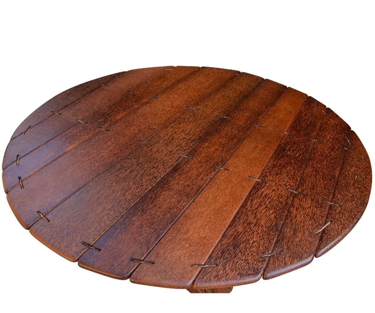 This sought after table from Pacific Green Furniture Co. in Fiji is handcrafted and hand finished using 100 year old palm trees that have exceeded their fruit production years. The resulting palmwood is as durable as it is beautiful and yet