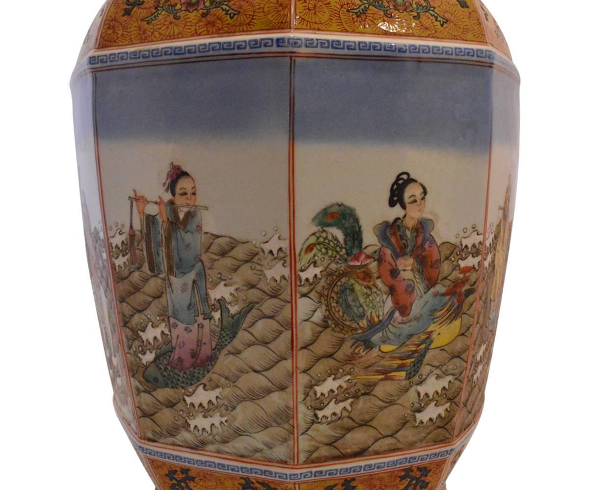 This Chinese faceted vase has a wide shouldered form showing repeated floral motif with bat and Buddhist subjects to the upper and lower registers with the eight immortals featured on the fact panels. This is highly decorated and impressive vase.