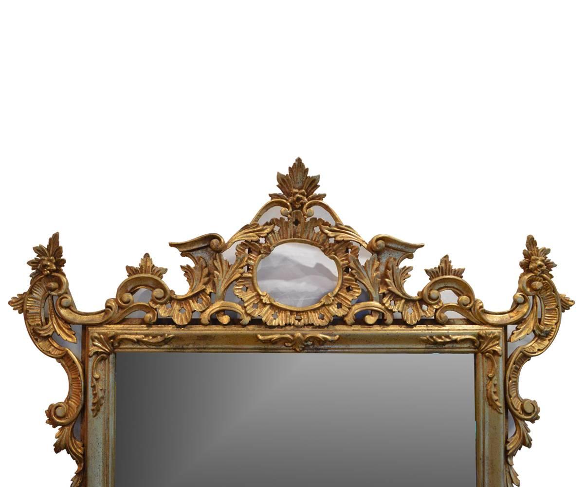 This is a fine Louis XV style gold gilt mirror with a Rococo flavor.