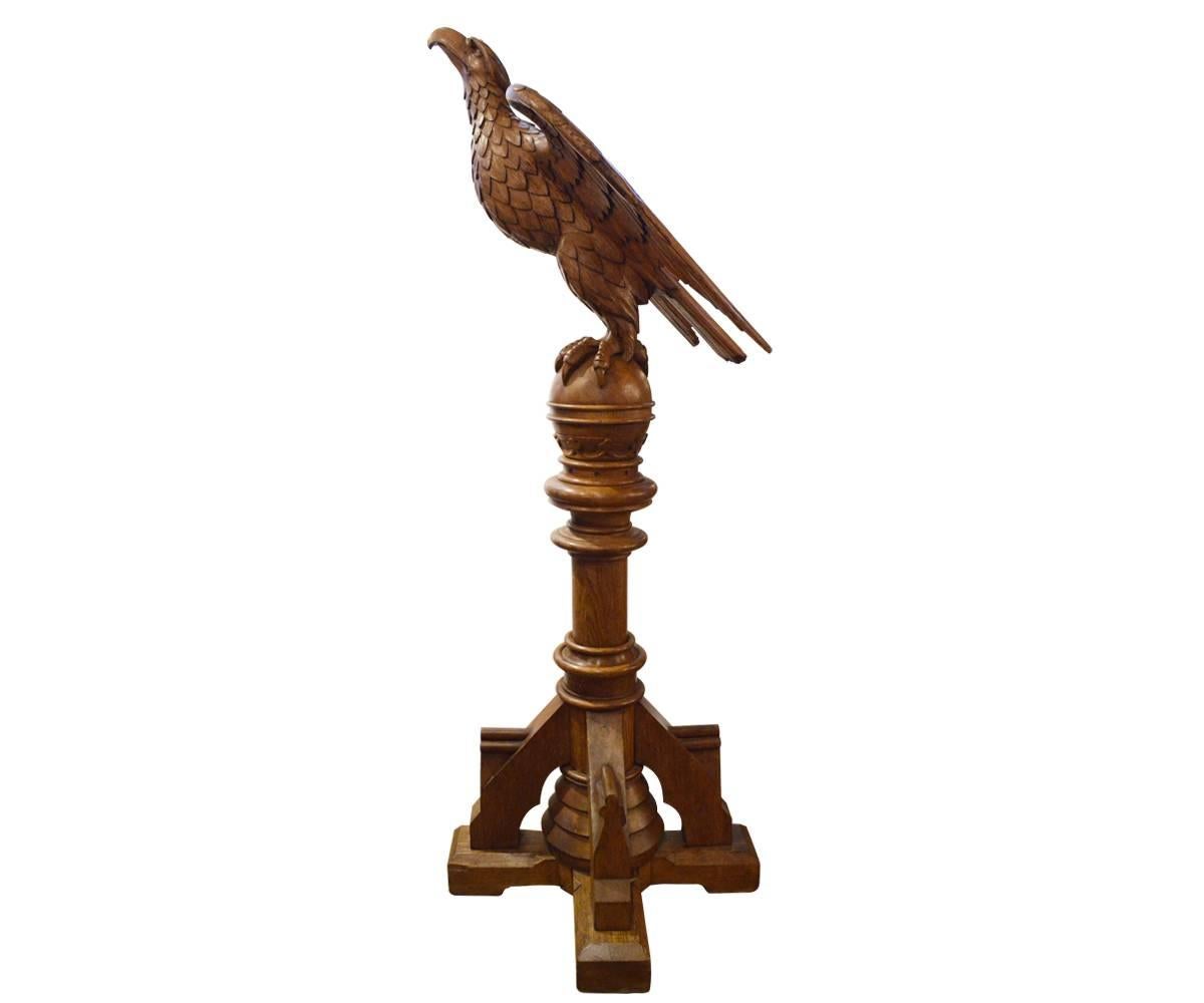 This antique piece can be used as a statue but was originally designed to be used as a book holder, lectern or podium. We can refinish to a darker stain if desired. This lectern has a French Gothic feel.