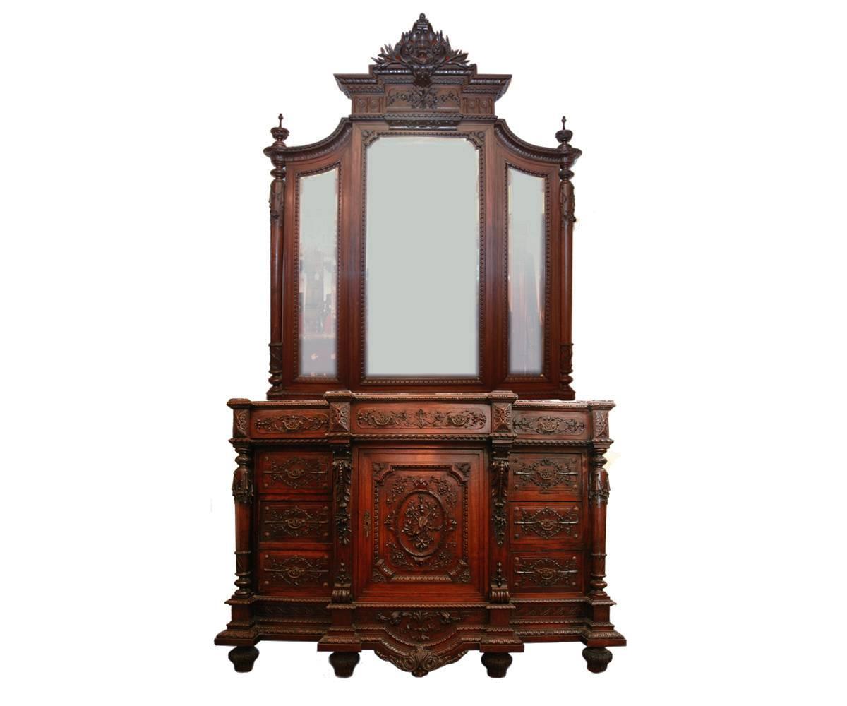 Offered is a three-piece antique French Louis, the XVI hand-carved 19th century walnut bedroom set consisting of: An armoire with an original beveled mirror front with an attached secretary which would make an excellent jewelry cabinet, a dresser