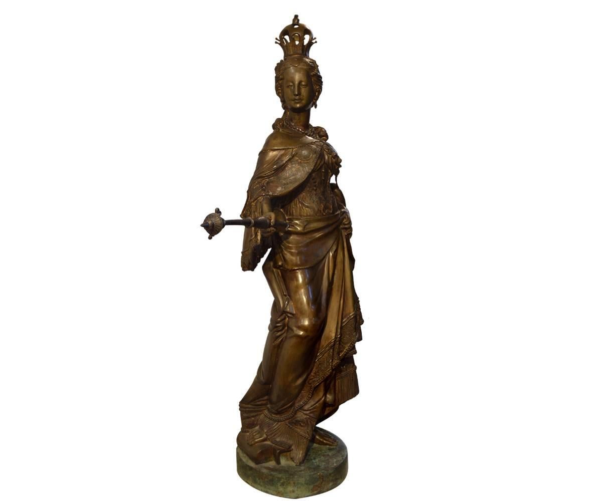 This beautiful bronze figure has incredible presence. We haven't been able to attribute or identify her, maybe you can! She is absolutely mesmerizing and will be a great addition to any space. She has a great cape, a wonderful crown, an important