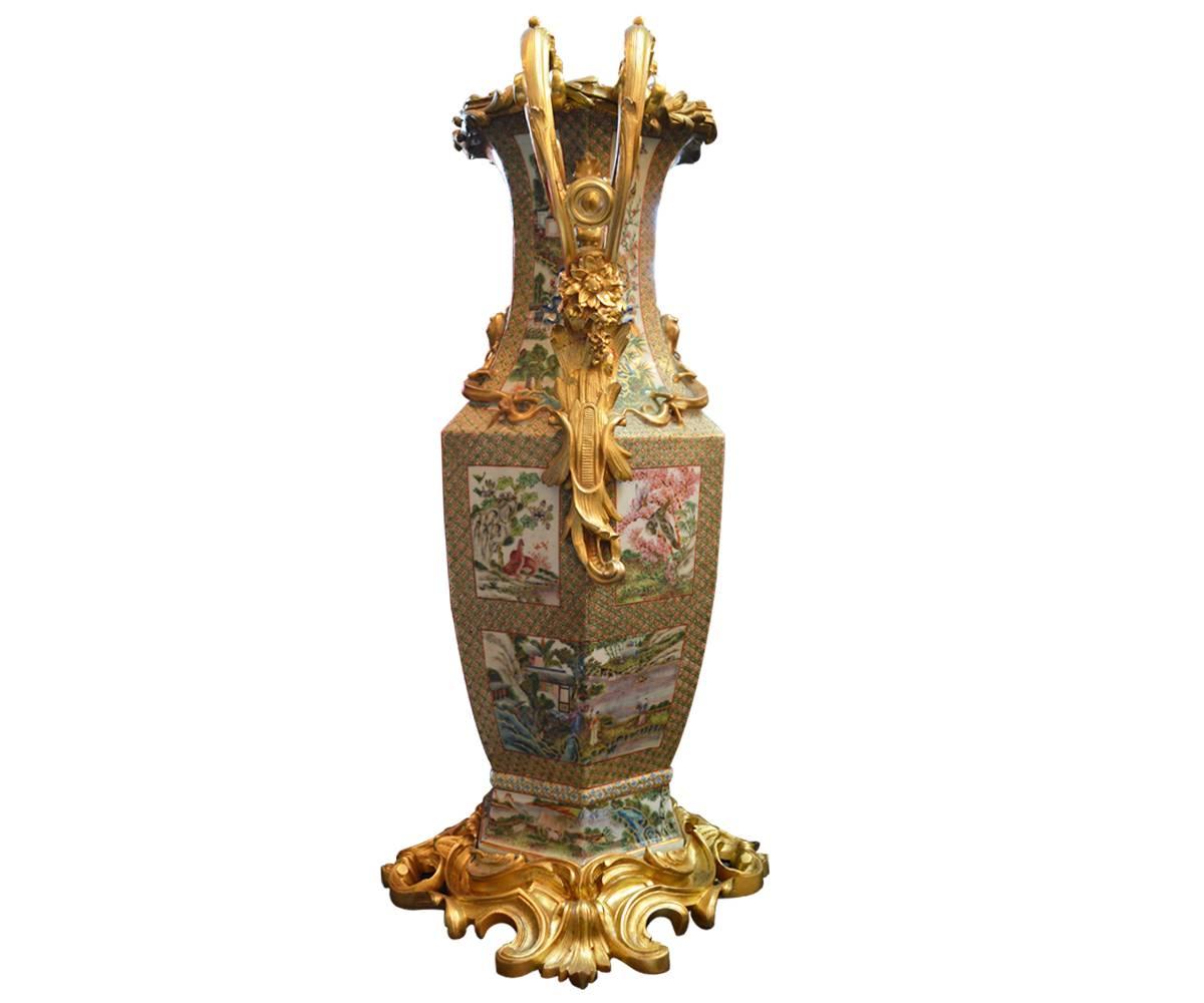 These superb Royal Canton rose Medallion vases have gilt bronze handles and base. These are absolutely everything one looks for in such a pair. This exceptional, hand-painted pair is early 19th century. The colors, gilt work and painting is as fine