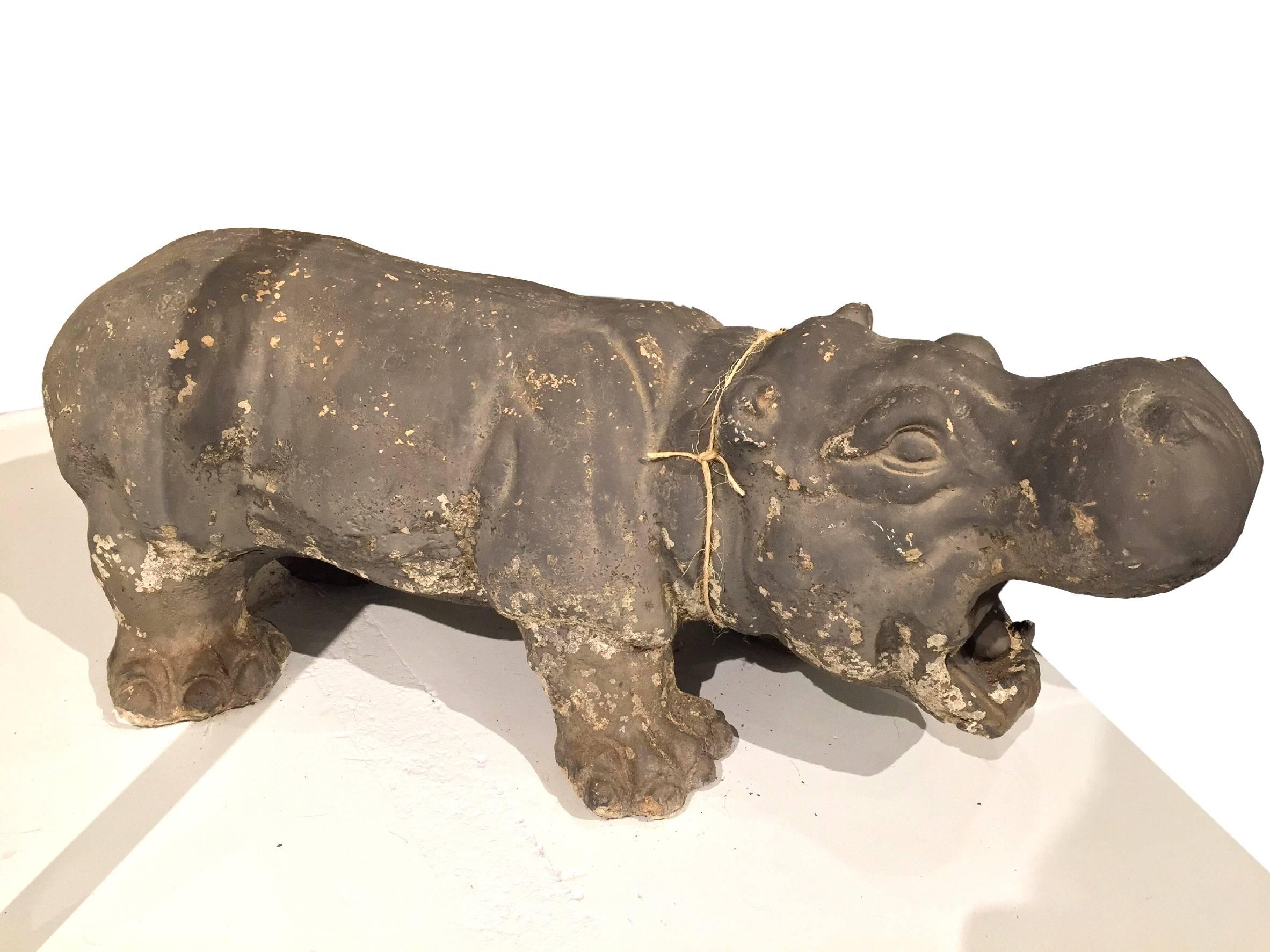 This is a rather heavy cement hippo sculpture, a great art accessory addition.
Weight: 75 lbs
