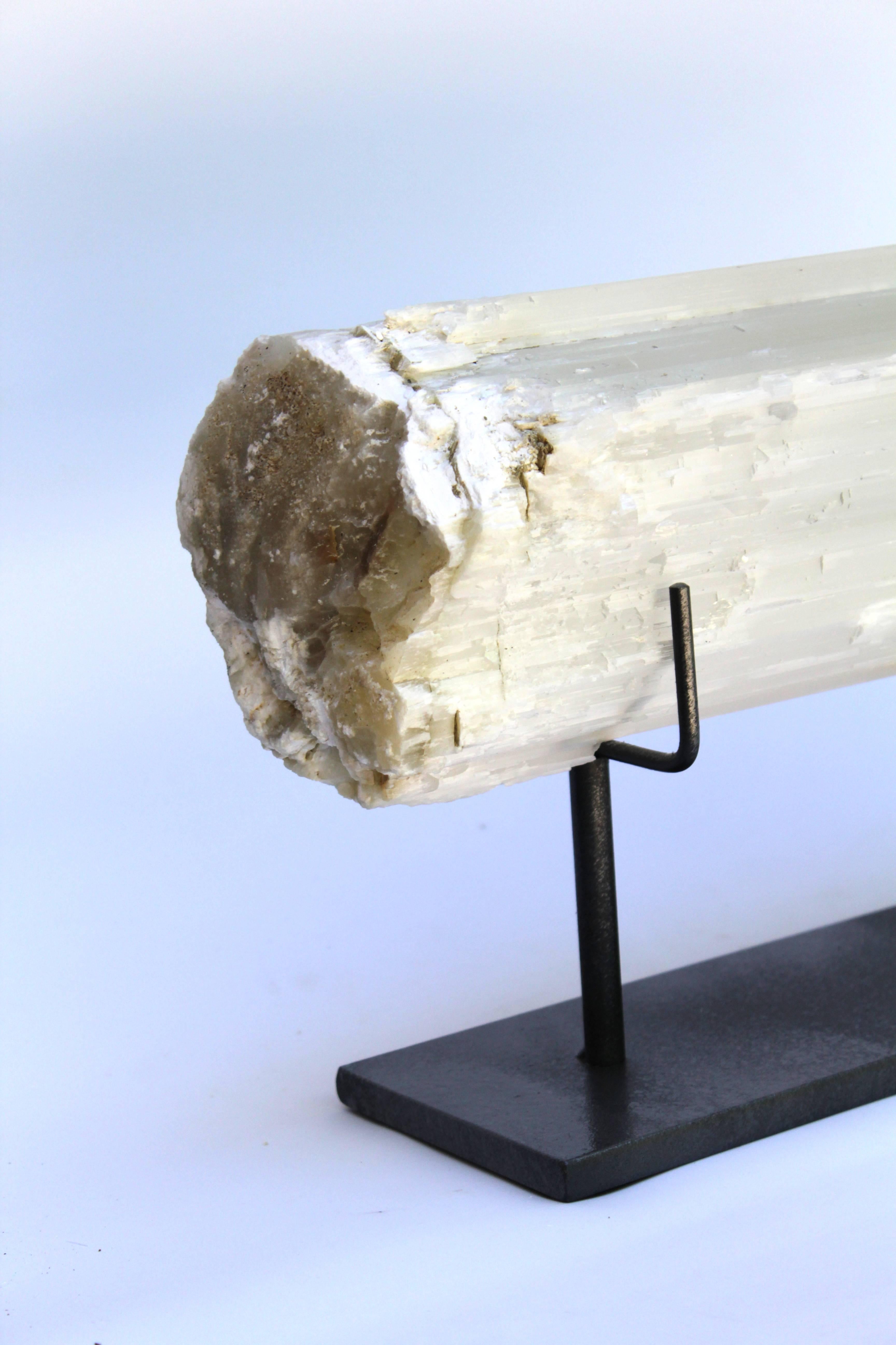 A selenite log is a single, prismatic crystal from Morocco that was formed in extensive beds by the evaporation of ocean brine. This mineral is characterized by a silky, pearly luster called satin spare.
Measures: Size: 19” long x 6” tall x 5”