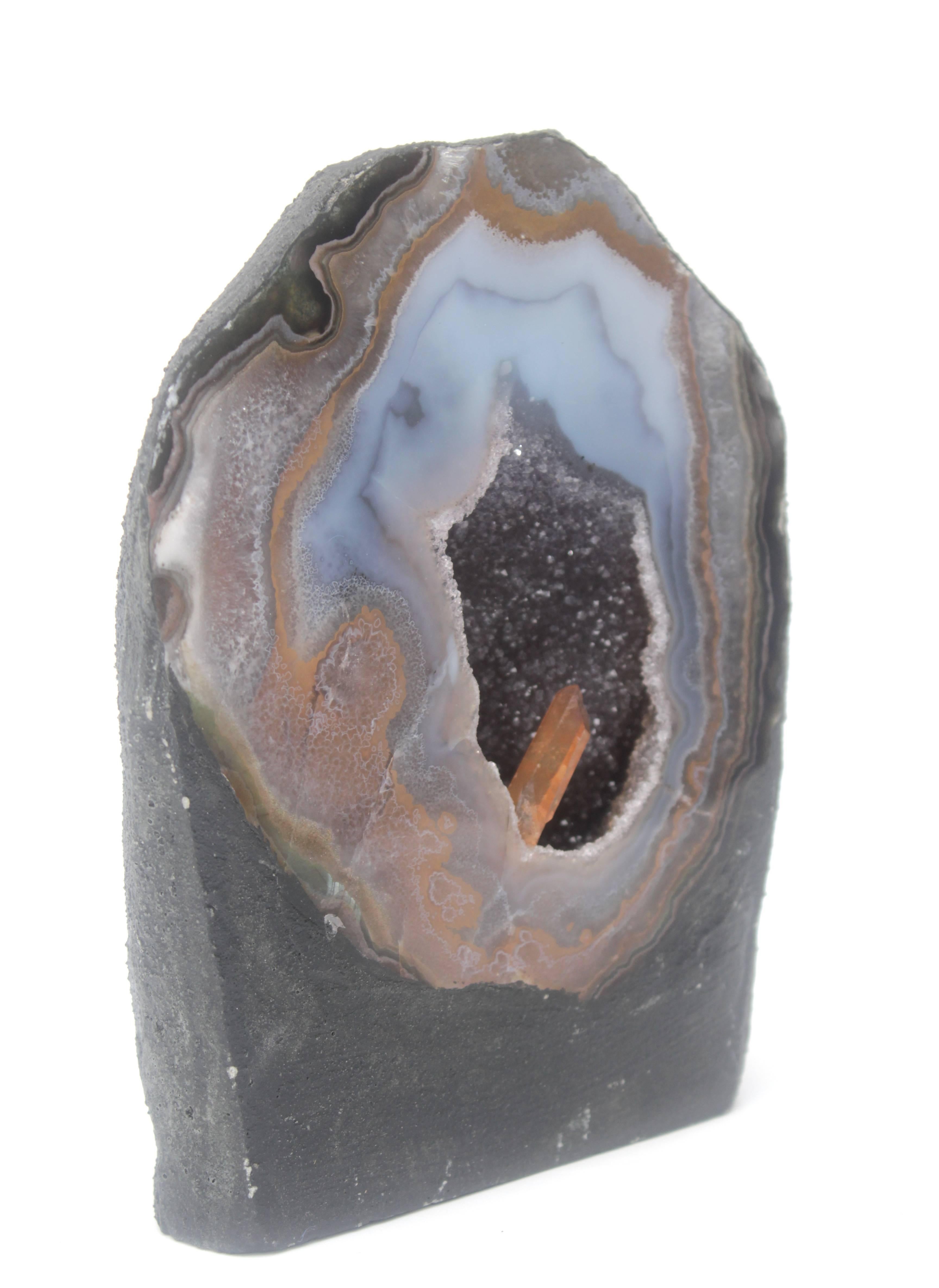 Polished natural specimen agate amethyst geode with a tangerine crystal point. Great art accessory!!!

Weight: 5 lbs.