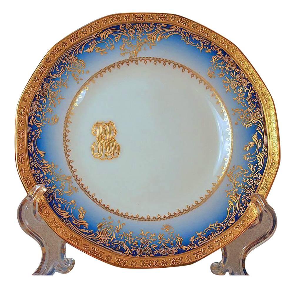 One of the kind mysterious vintage extended dinner service for 12+ by Limoges and T. Haviland made by special order in 1938. Please see the history below. Elaborate gilt painting over a gradient rich cobalt blue background that fades into a ring of