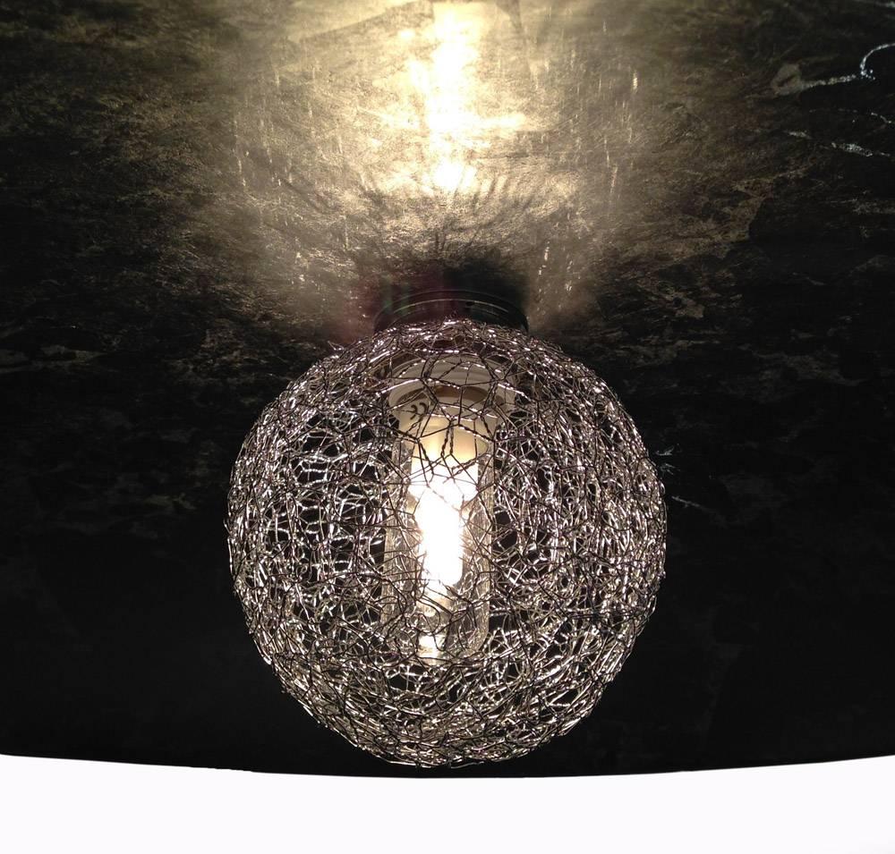 Modern art glass silver leaf round Italian chandelier with handmade elements designed by Marco Pagnoncelli. This piece showcases a broad glass bowl with hand-applied silver leaf, giving it a wonderful texture and sheen. A handmade silver mesh orb