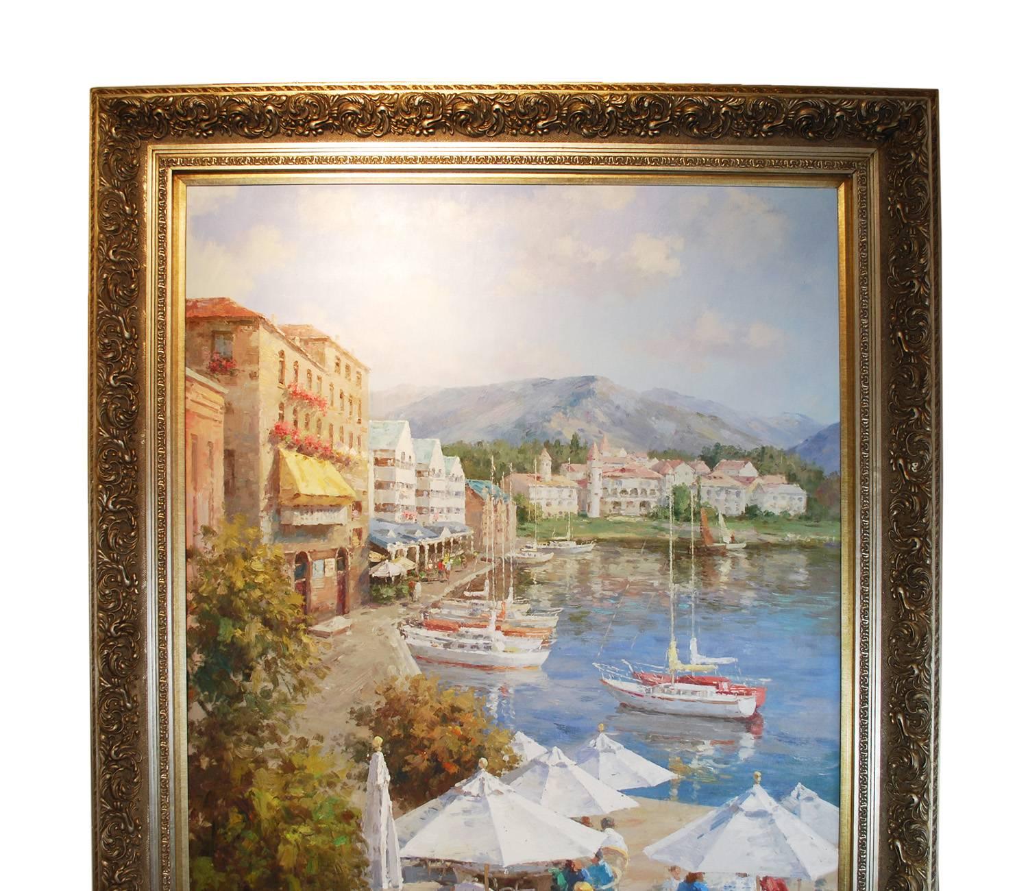 An impressively large size harbor scene in a Mediterranean type setting, framed oil on canvas. Outside cafe with white umbrellas merge water and pleasure yachts pull in to dock in front of old shops and stucco buildings. Mountains loom in the
