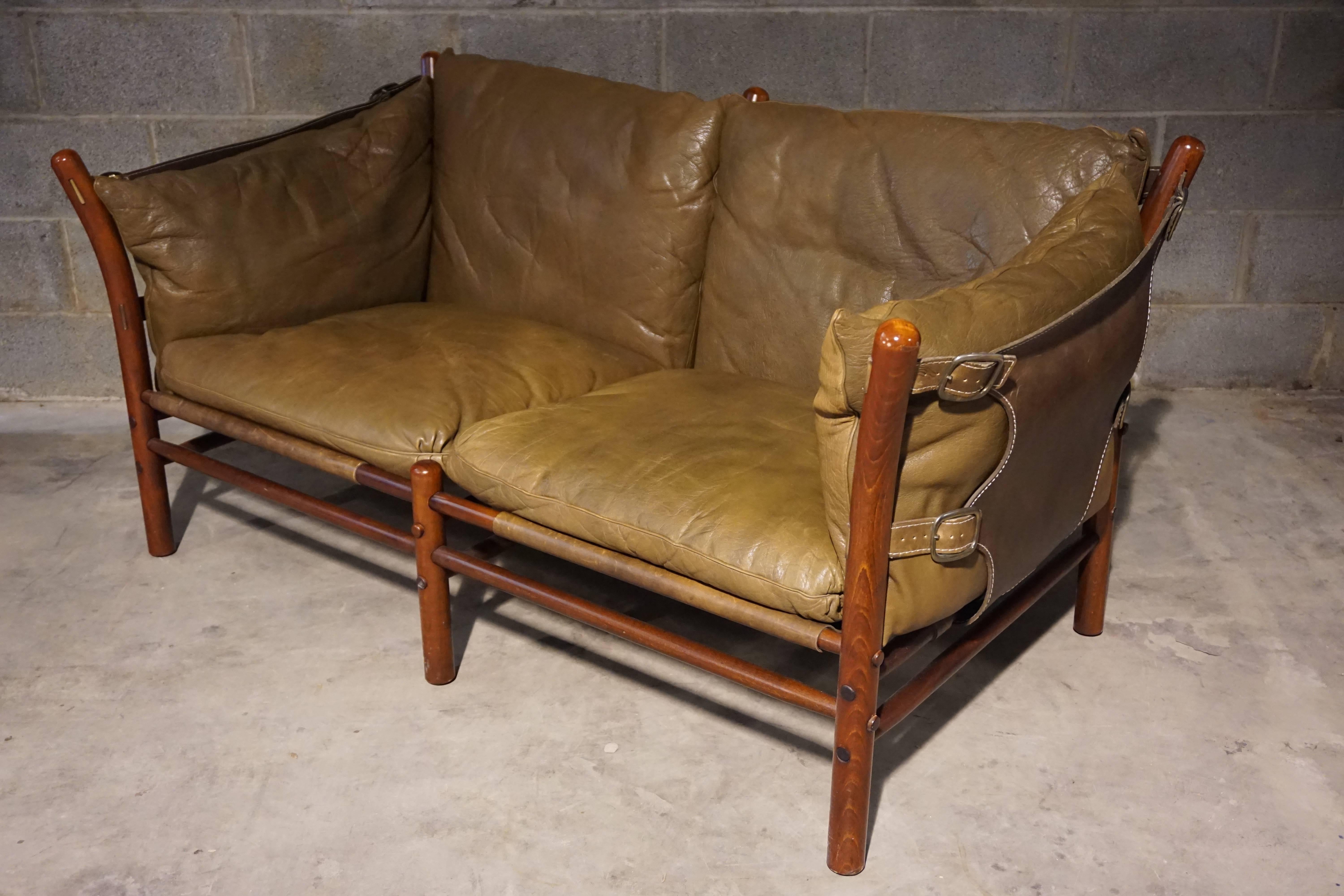 Two-seat leather sofa designed by Arne Norell. Beech frame and harness leather, Manufactured by Aneby Mobler, Sweden.
 